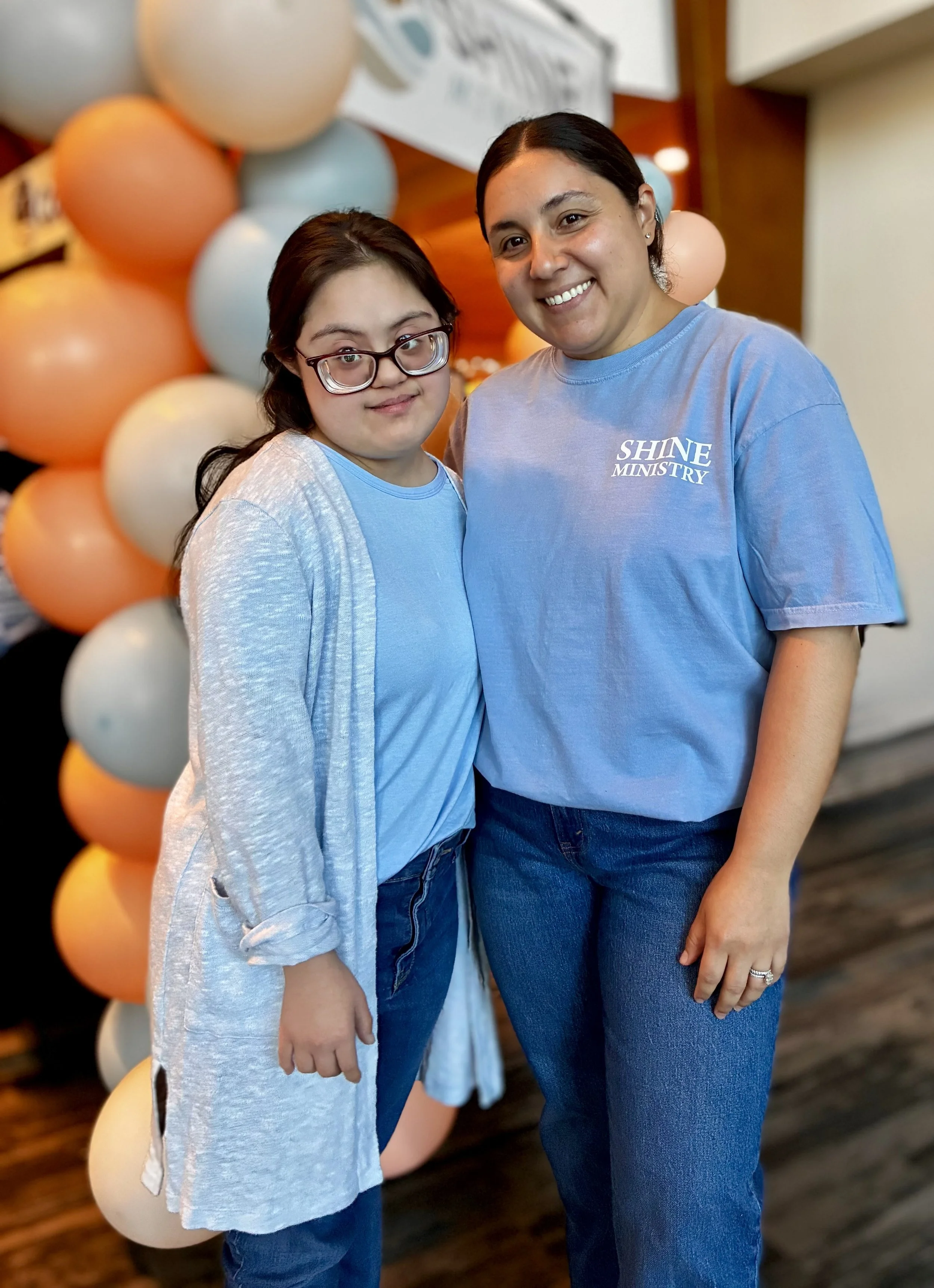 Michelle Nitti with young adult client, highlighting supportive speech therapy relationships.