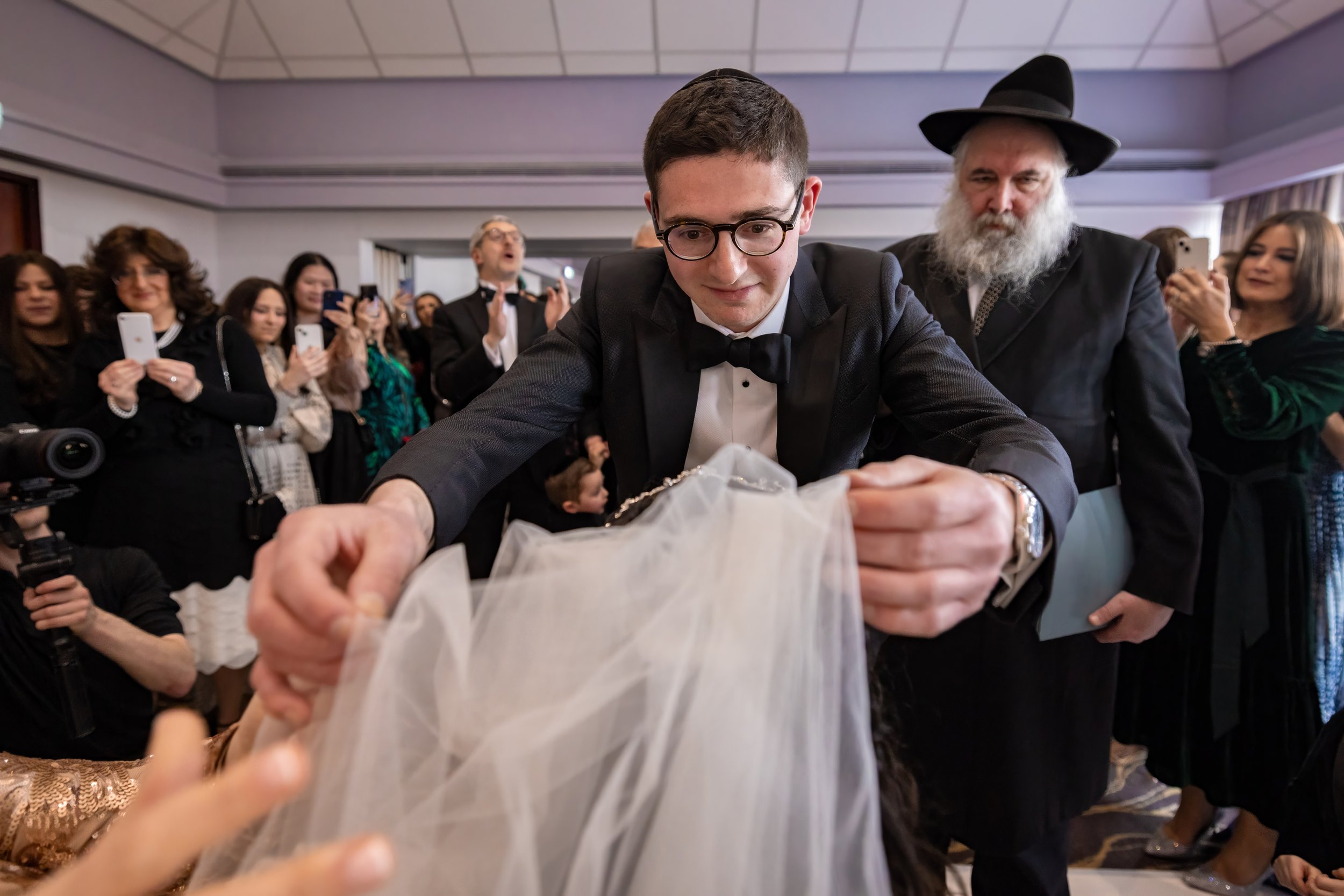 kallah bride and chosson groom during bedeken at charedi jewish wedding