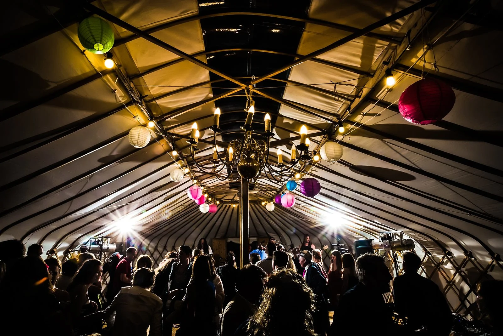 Atmospheric shot of crowd at wedding party in a yurt