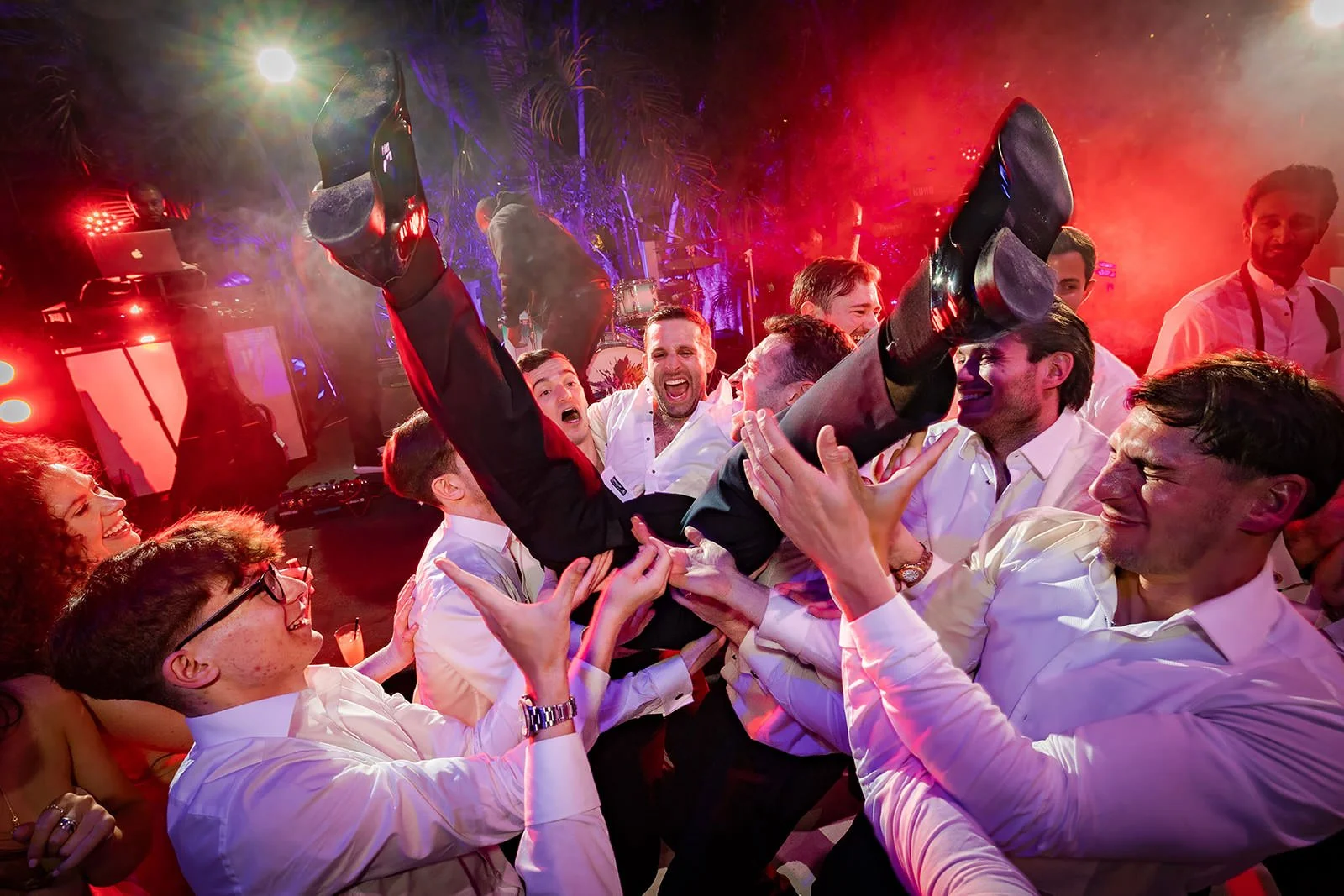 groom held up dancing at wedding reception at sefton park palm house in liverpool