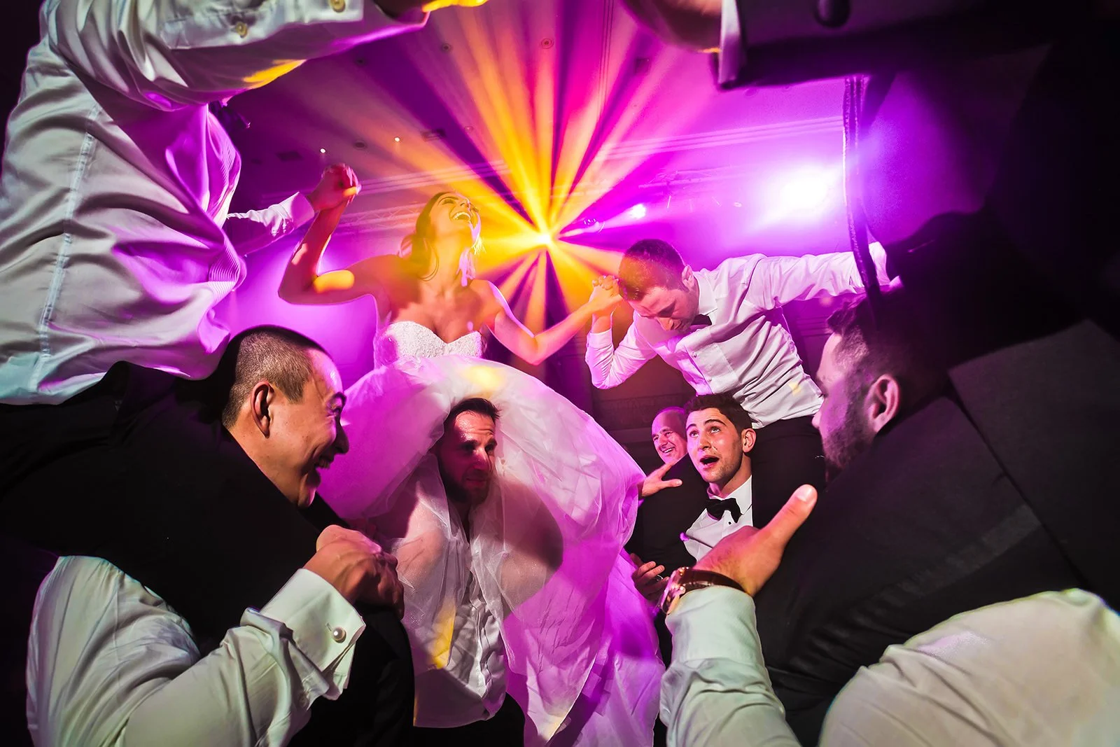 Manchester jewish wedding photographer bride and groom on shoulders during dancing dance floor reception