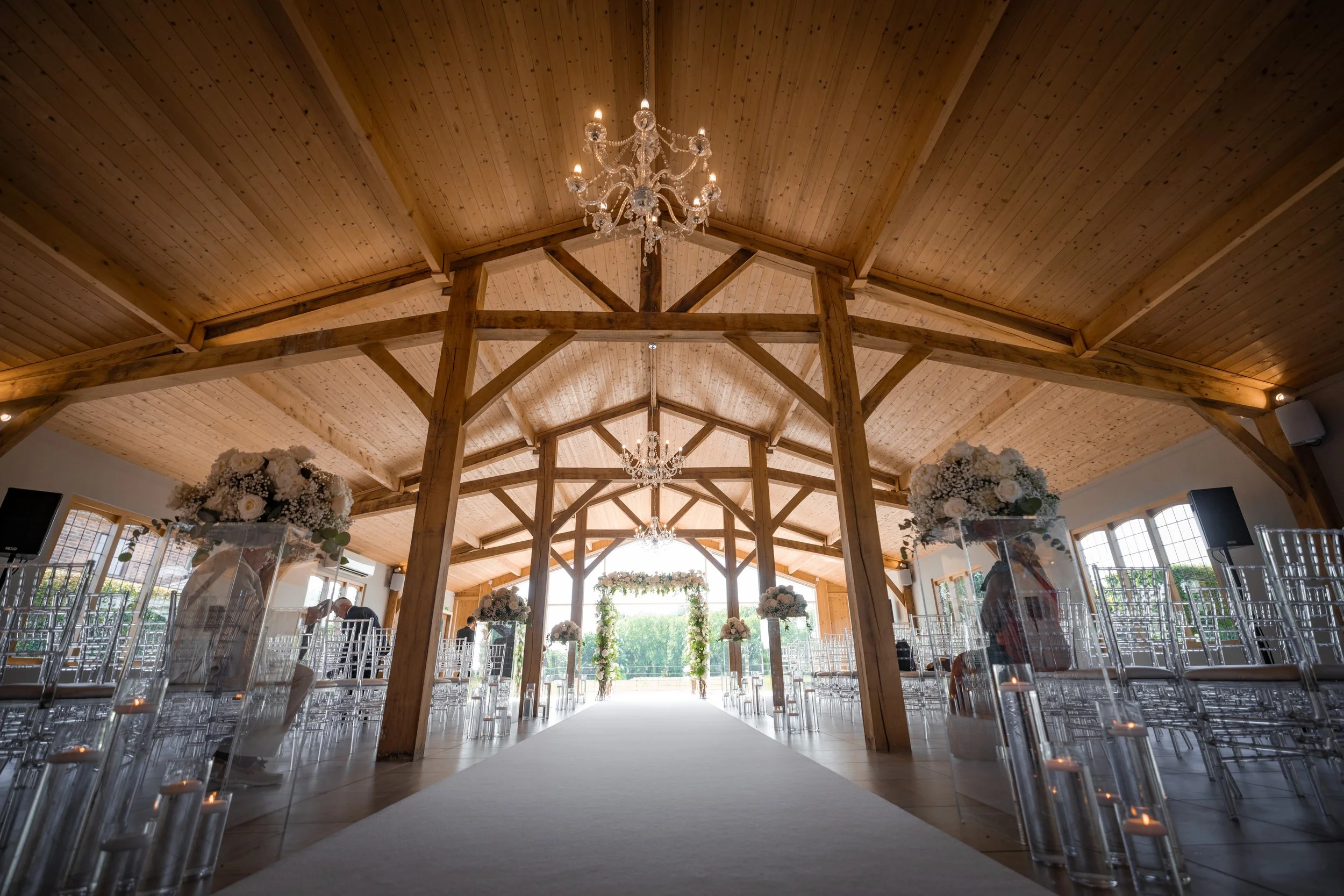 Merrydale Manor wedding venue wooden beams chandeliers aisle runner – documentary wedding photography Manchester