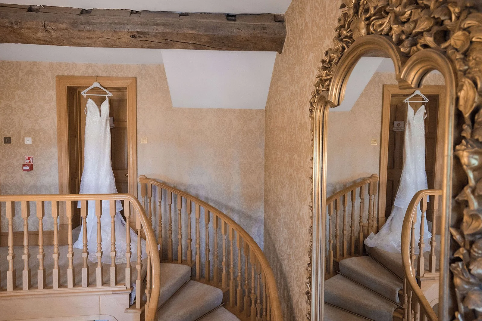 Merrydale Manor wedding dress hanging on door frame detail – documentary wedding photographer Manchester