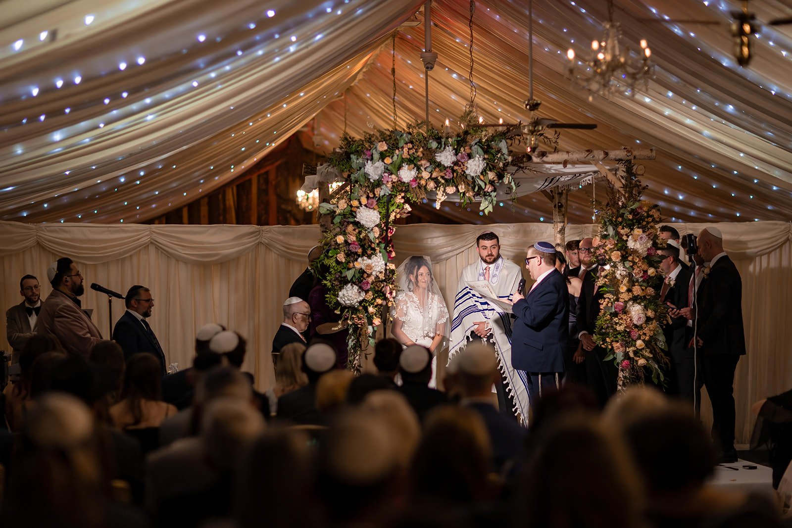 bride and groom exchange vows during wedding ceremony at heaton house farm in macclesfield
