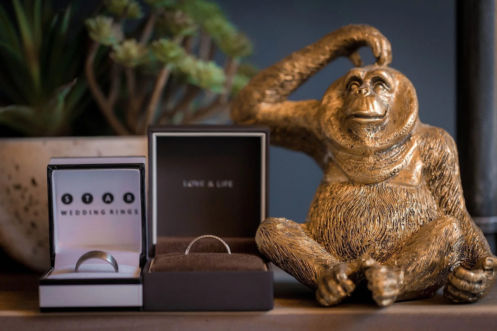 Merrydale Manor wedding rings detail with golden ornament display – wedding photography Cheshire