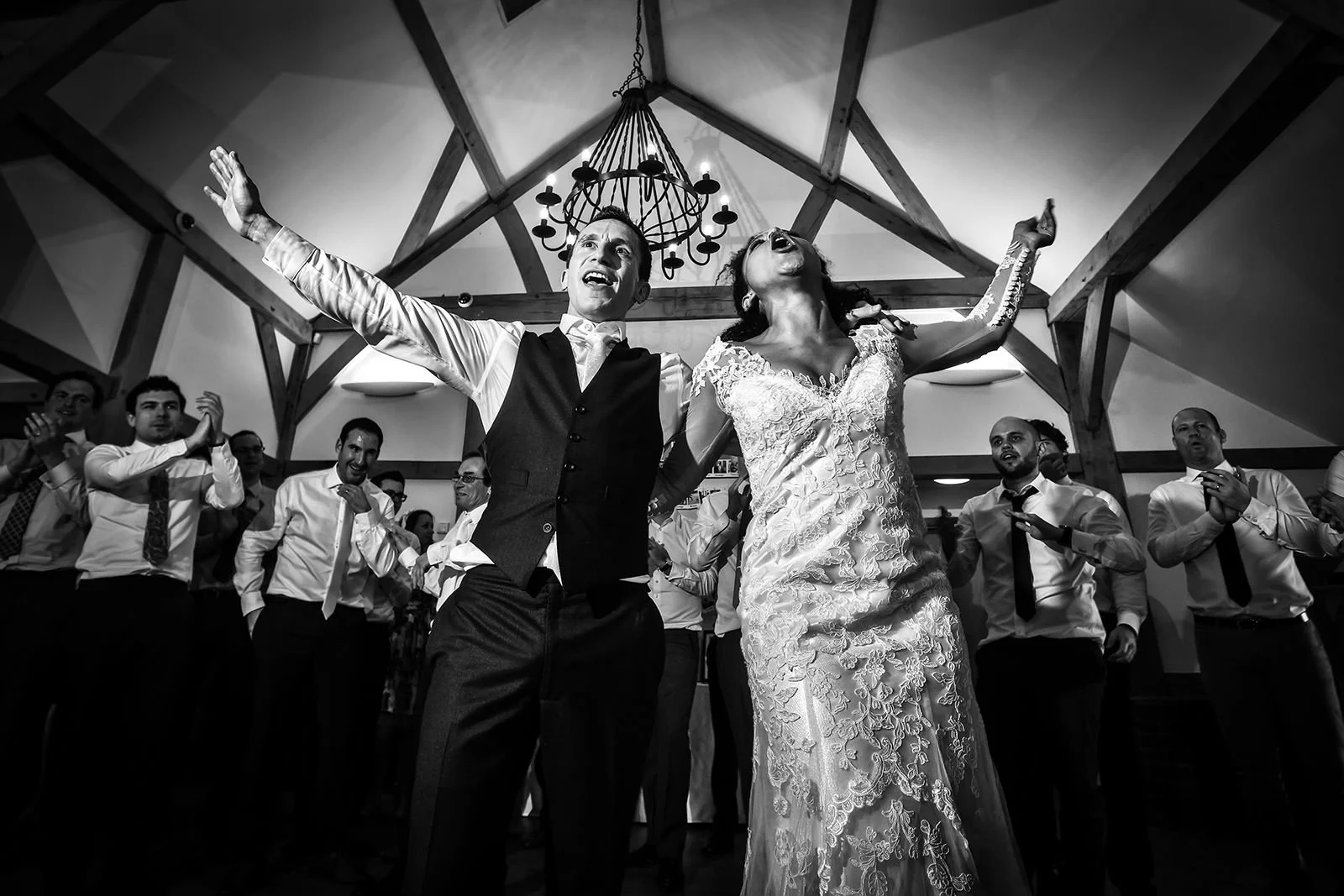 Bride and groom partying at Sandhole Oak Barn