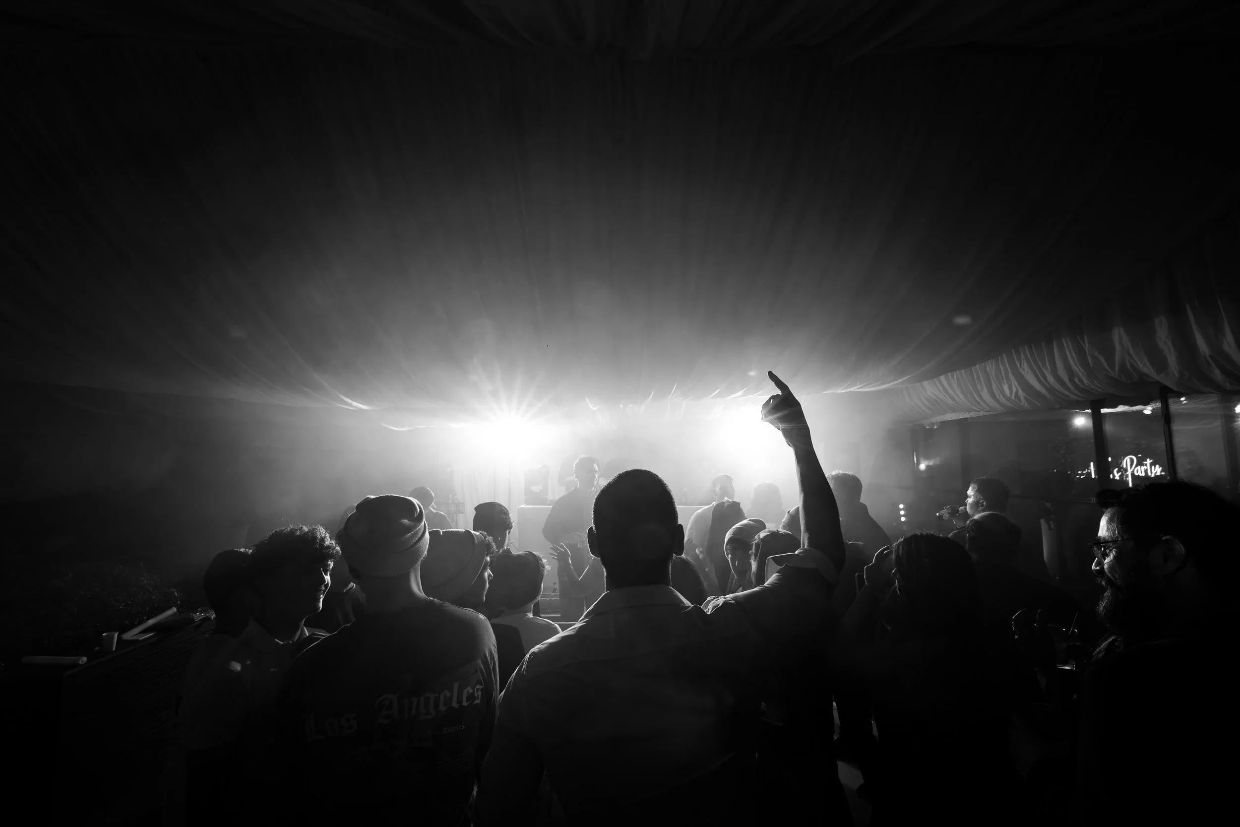 atmospheric black and white wide angle shot of crowd during barmitzvah celebrations in Manchester