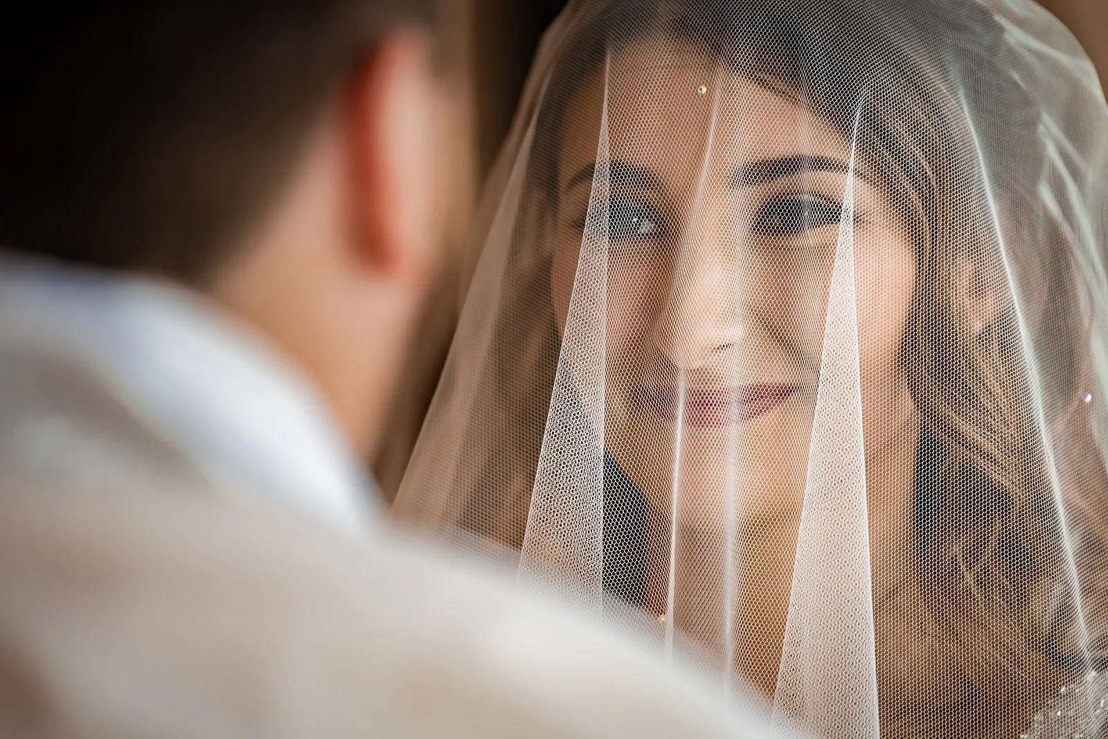 bride looks at groom during ceremony at colshaw hall in cheshire