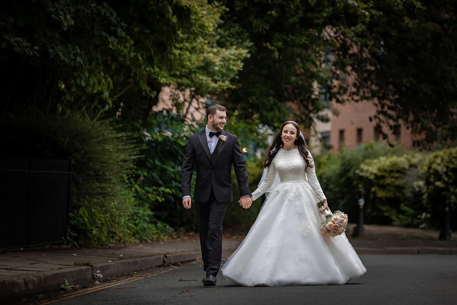 romantic newlywed bride and groom couple portrait outside manchester deansgate hotel