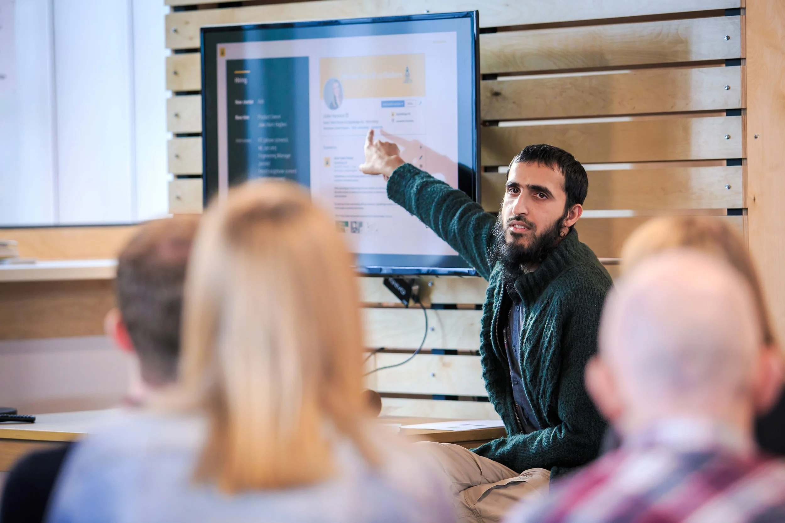 Team presentation taking place during a workplace meeting