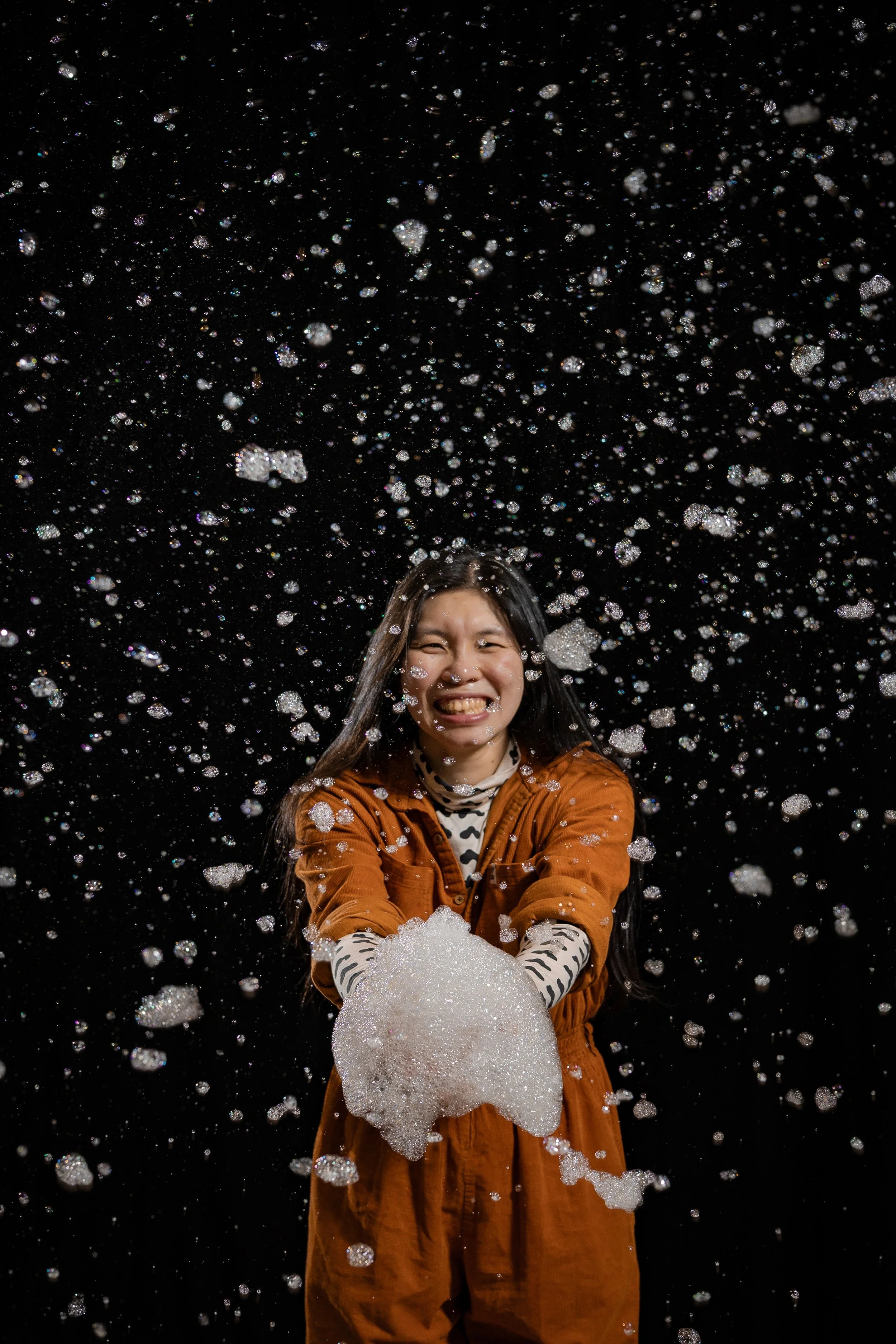 corporate-workshop-photographer-manchester-participant-foam-bubble-explosion-laughing-020.jpg