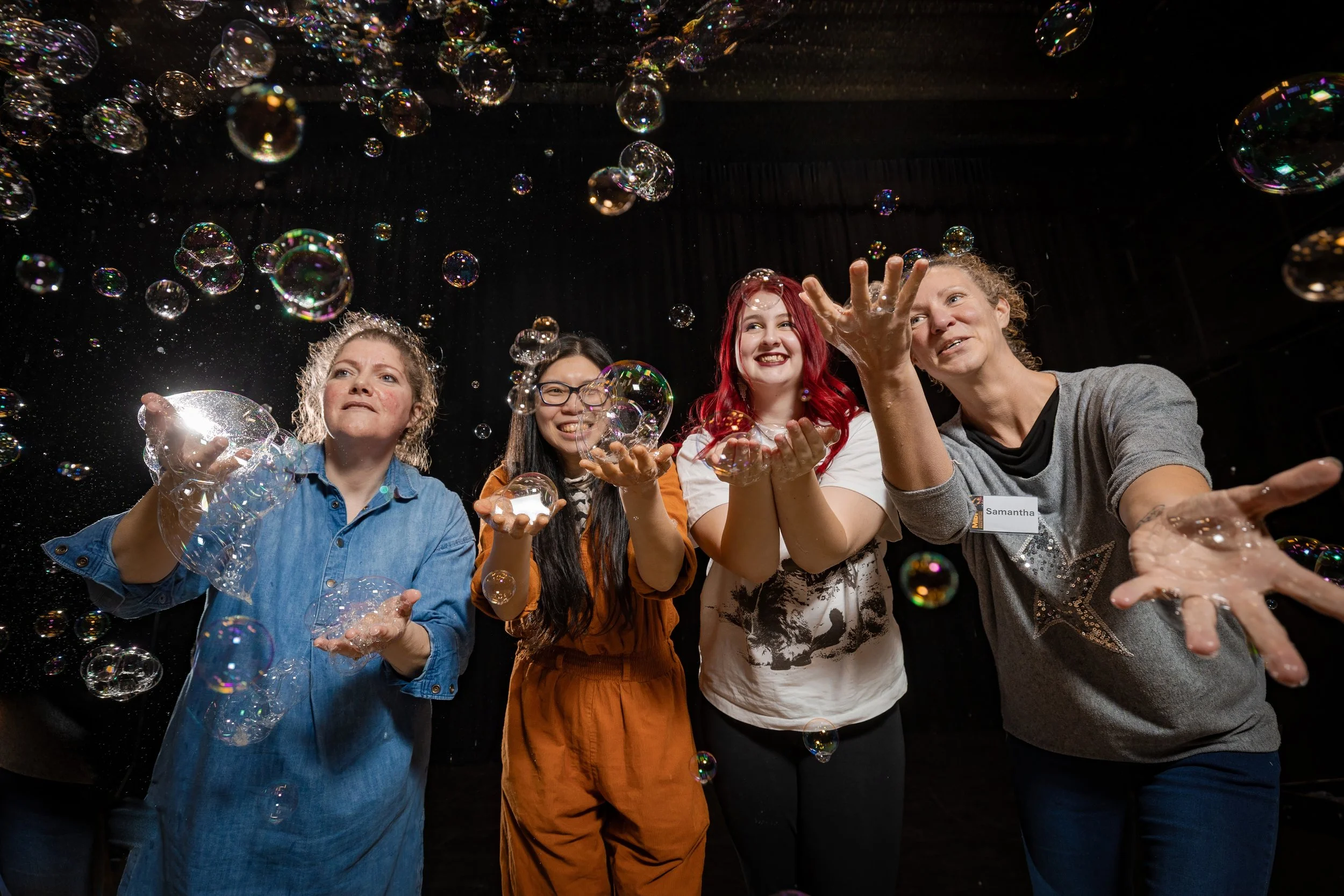 Guests enjoying bubbles and laughter during a workshop event