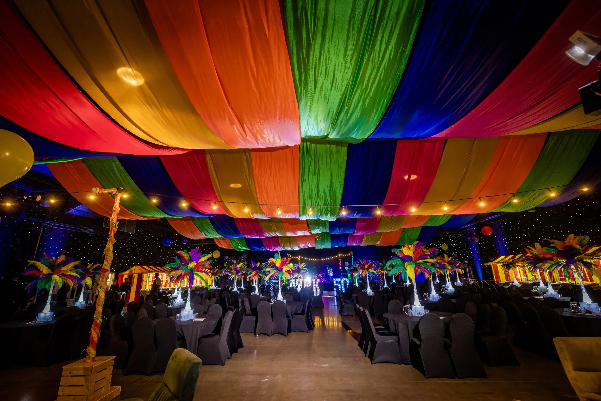 corporate-event-photography-anniversary-dinner-rainbow-ceiling-decor.jpg