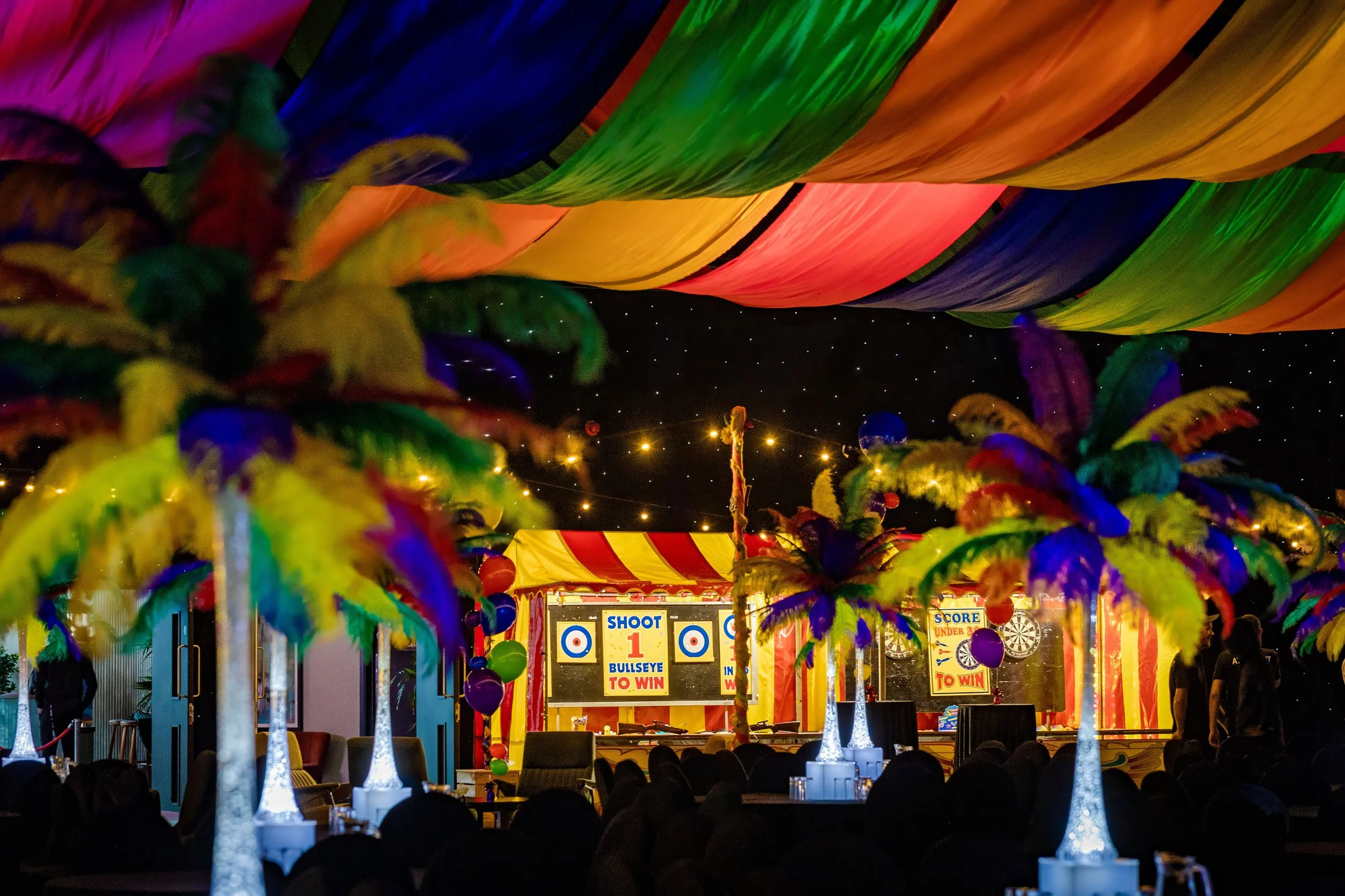 anniversary-event-photography-carnival-venue-room-setup-rainbow-ceiling.jpg