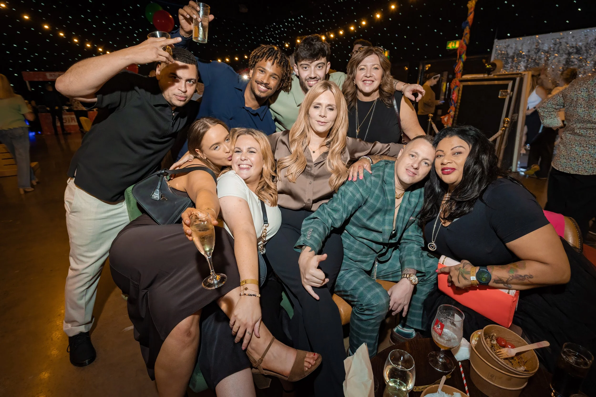 corporate-event-photographer-manchester-guests-group-celebrating-dinner.jpg