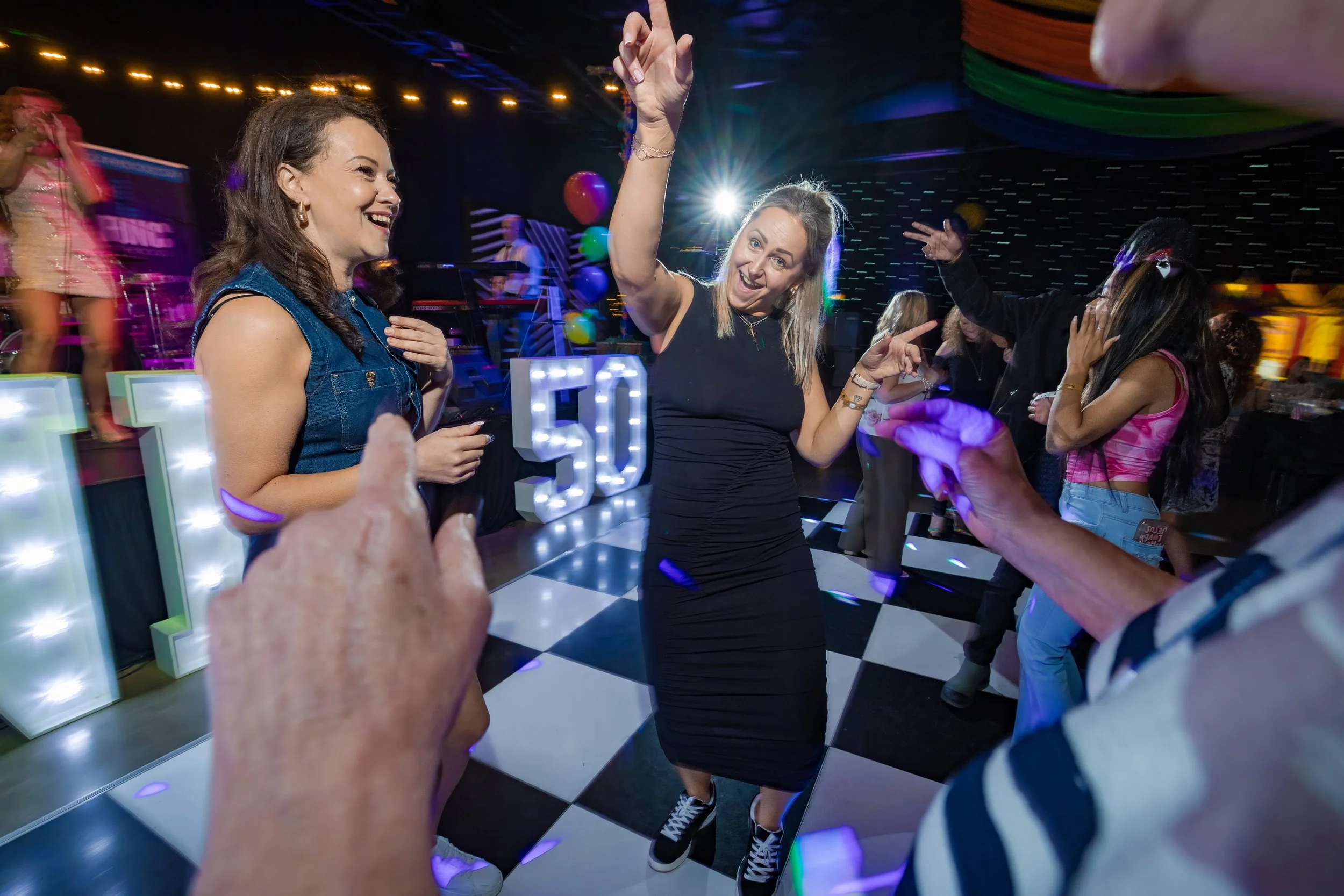 anniversary-event-photography-guests-dancing-50th-illuminated-numbers.jpg