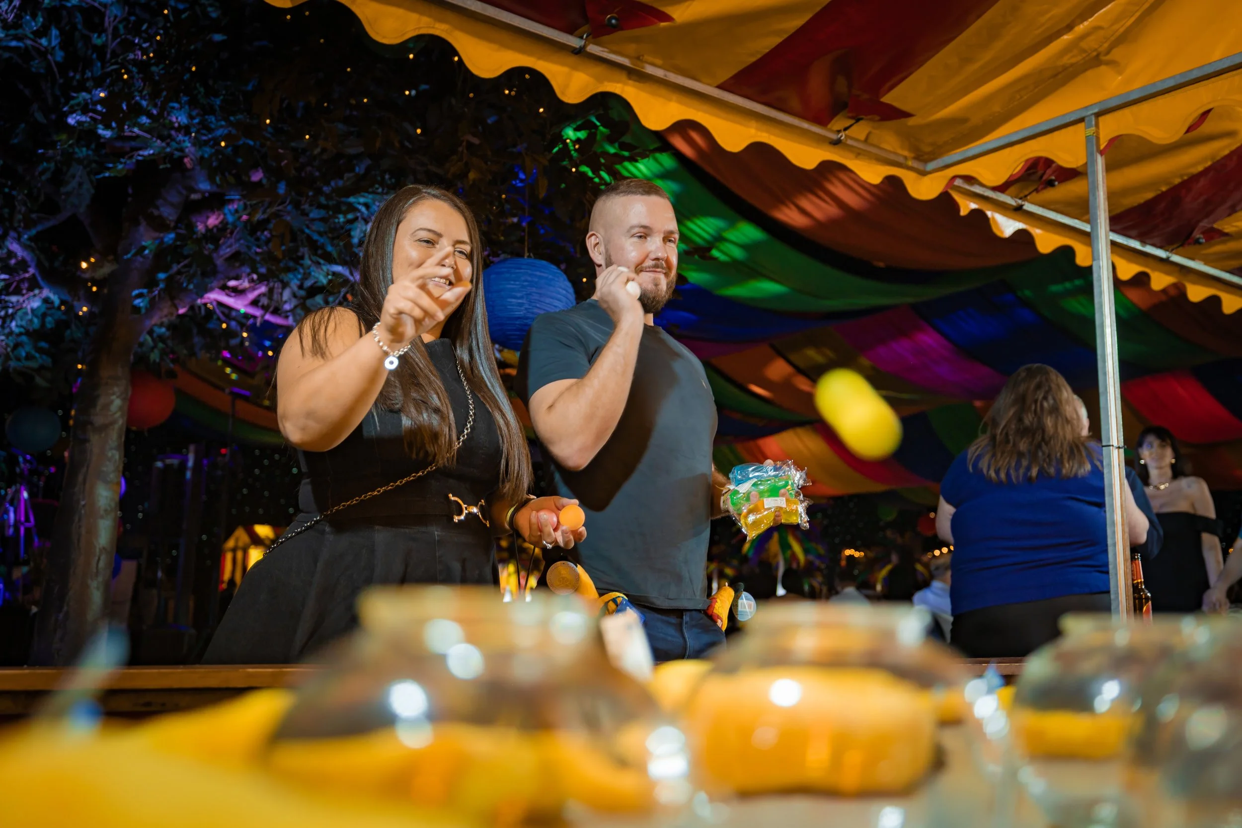 company-celebration-photography-guests-playing-hook-a-duck-fairground.jpg