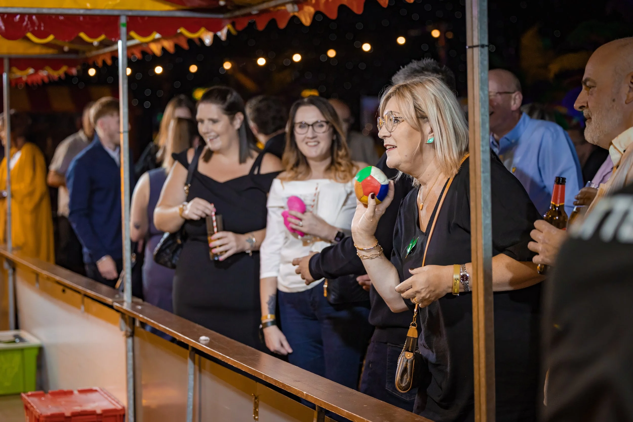 corporate-entertainment-photography-guests-playing-fairground-game-anniversary.jpg