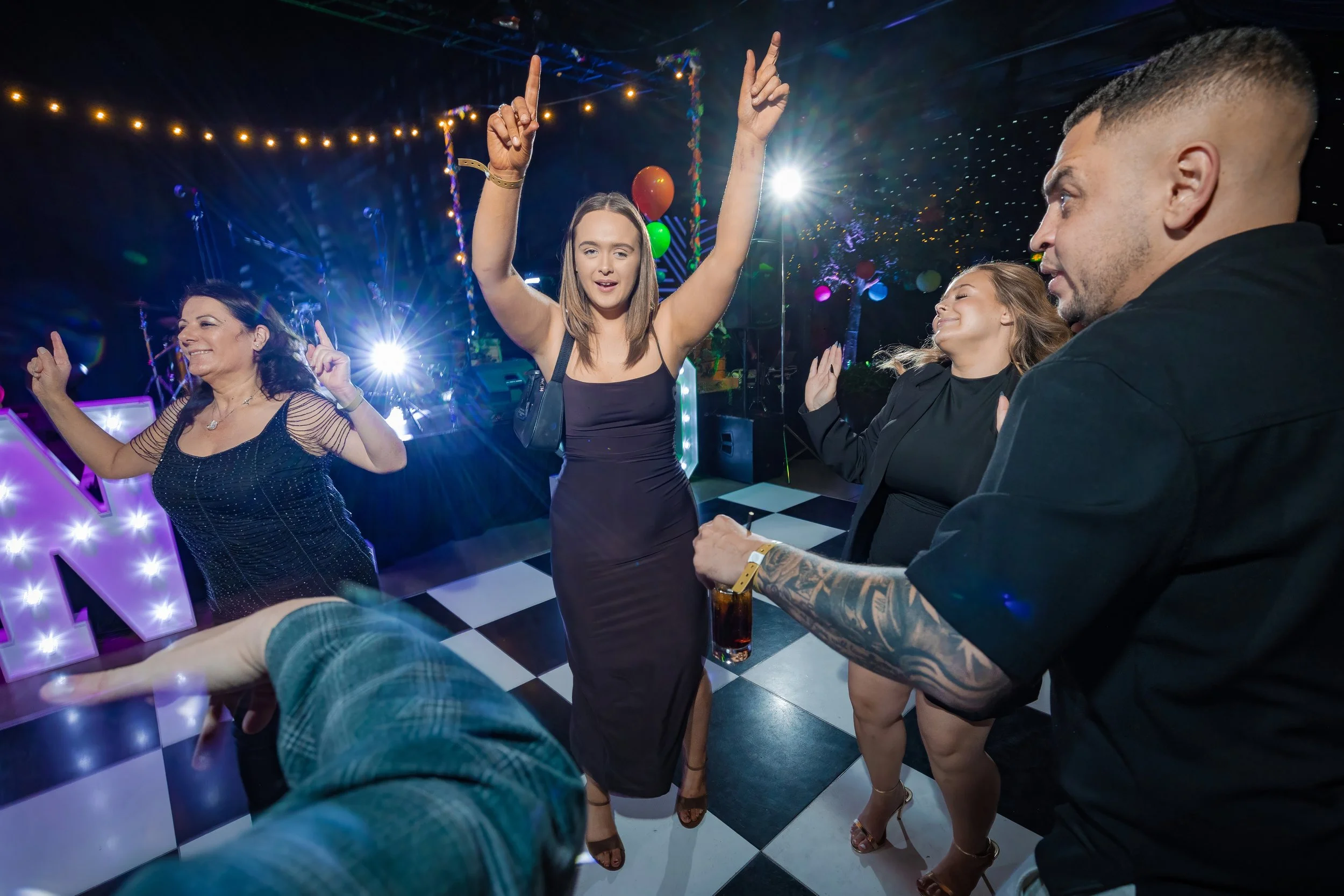 corporate-party-photography-guests-dancing-anniversary-celebration-dancefloor.jpg