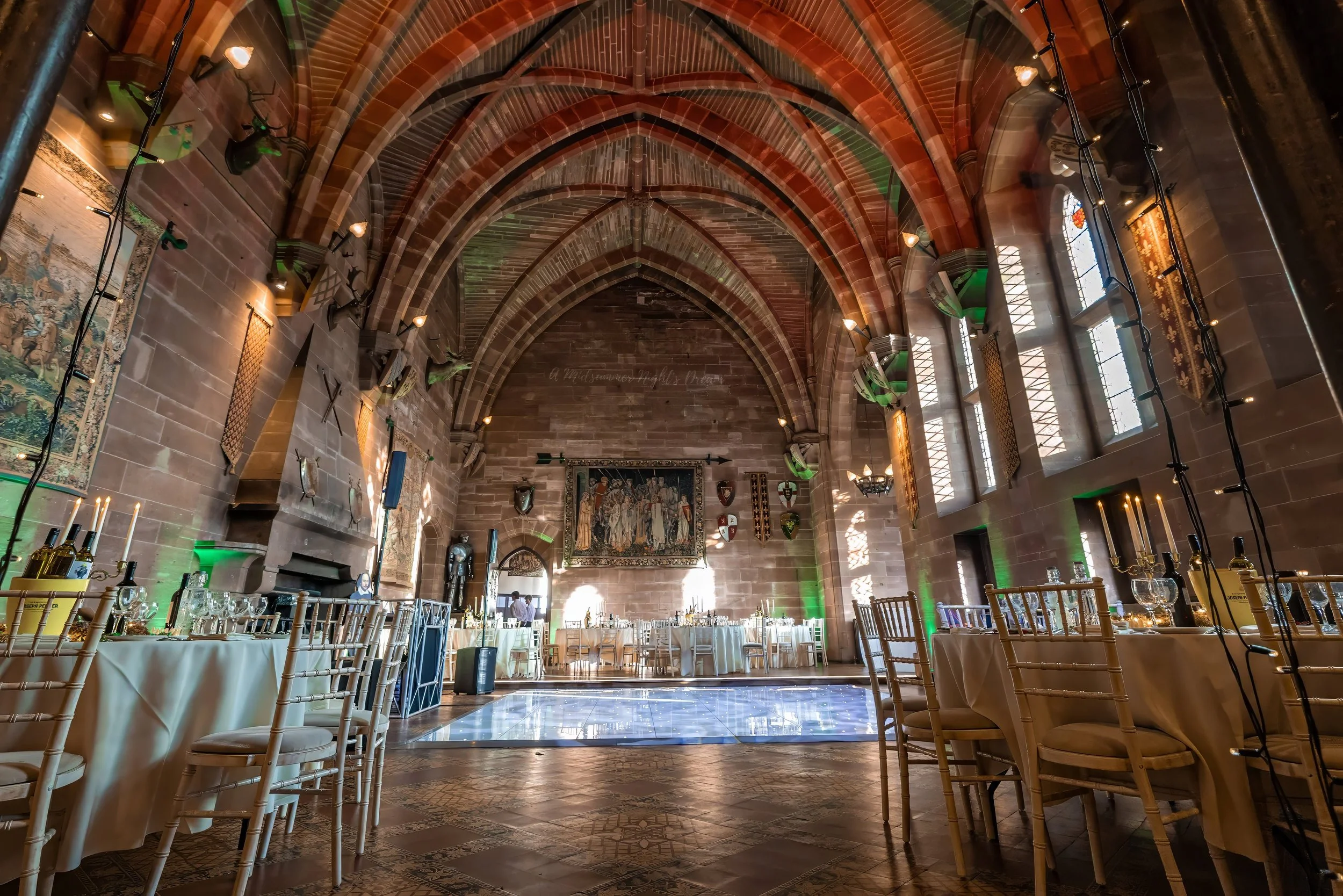 peckforton-castle-great-hall-event-setup-green-lighting.jpg