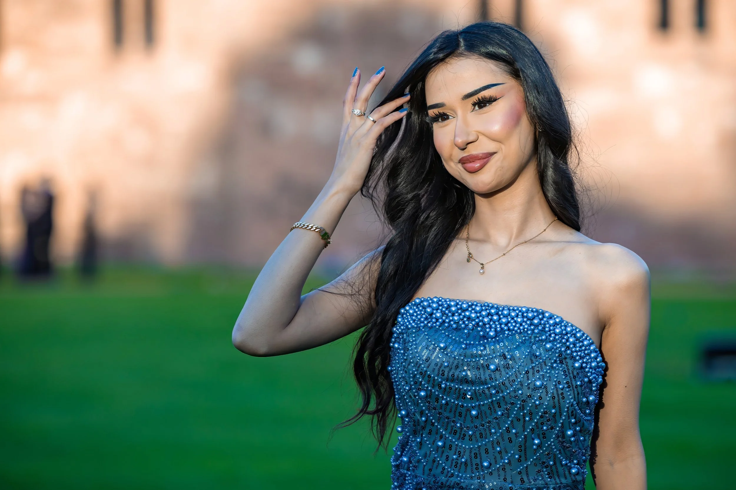 summer-ball-guest-portrait-beaded-gown-castle-lawn.jpg