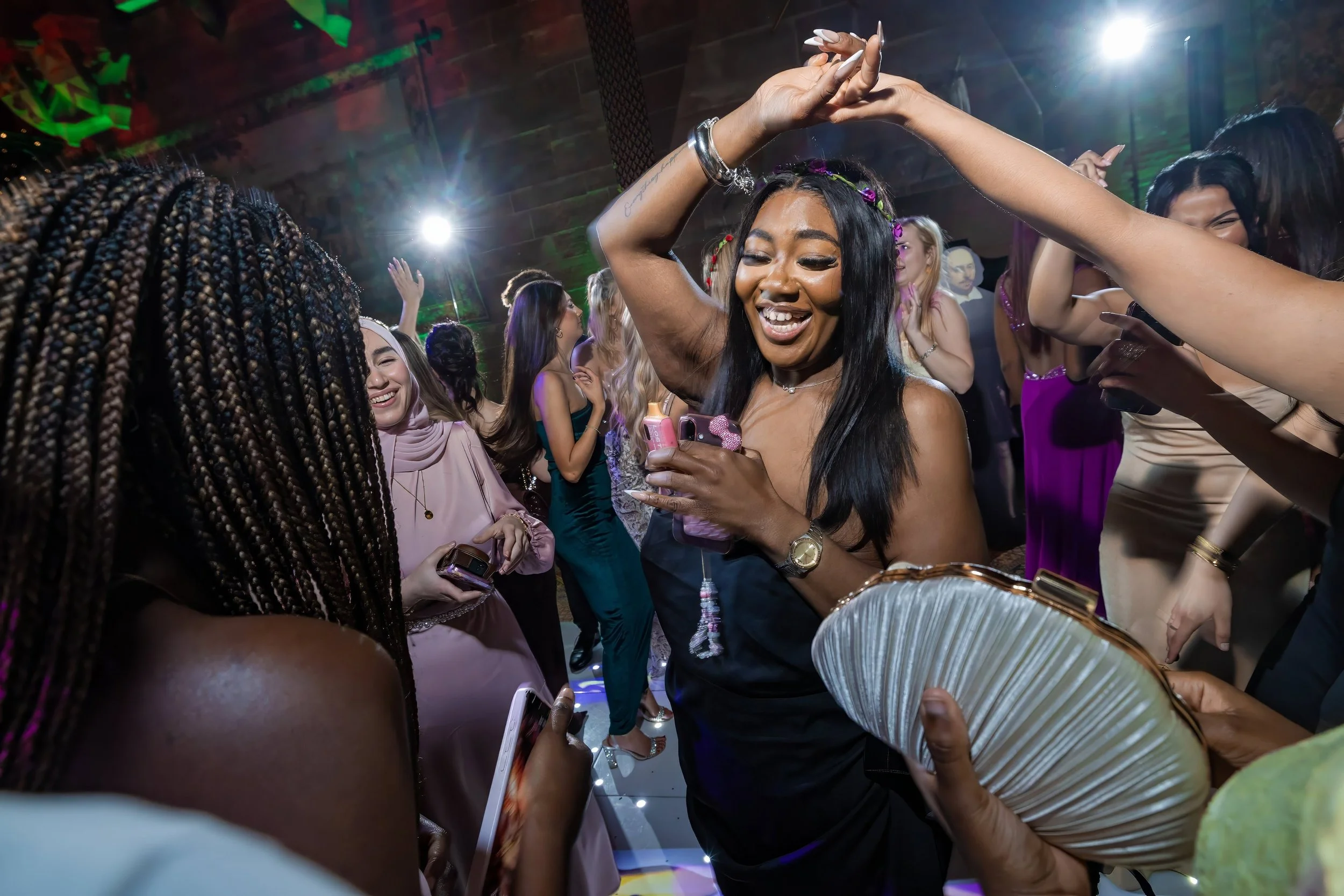 summer-ball-dancefloor-dancing-arms-raised-green-lights.jpg