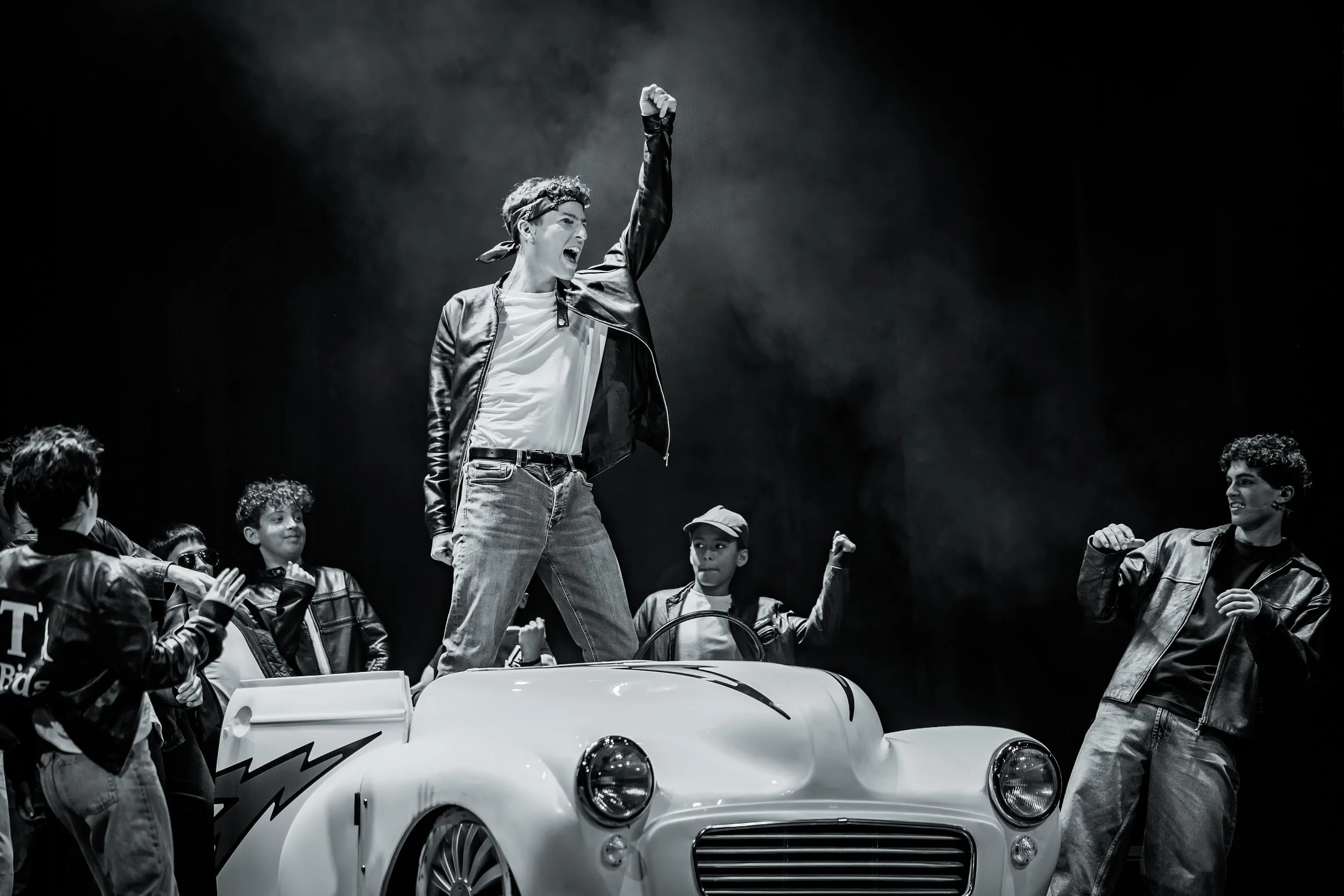 Cast performing a musical number during King David High School's production of Grease