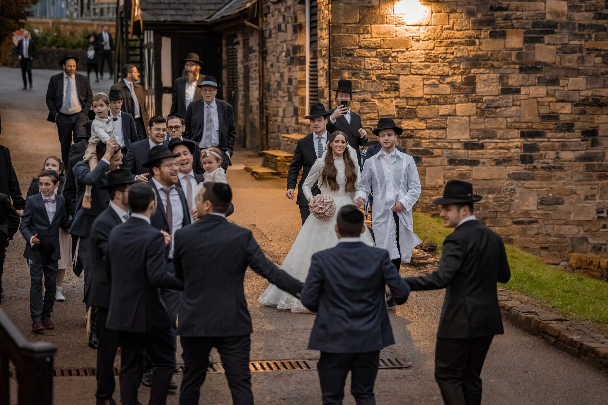 Jewish bride and groom make ther way to yechud room