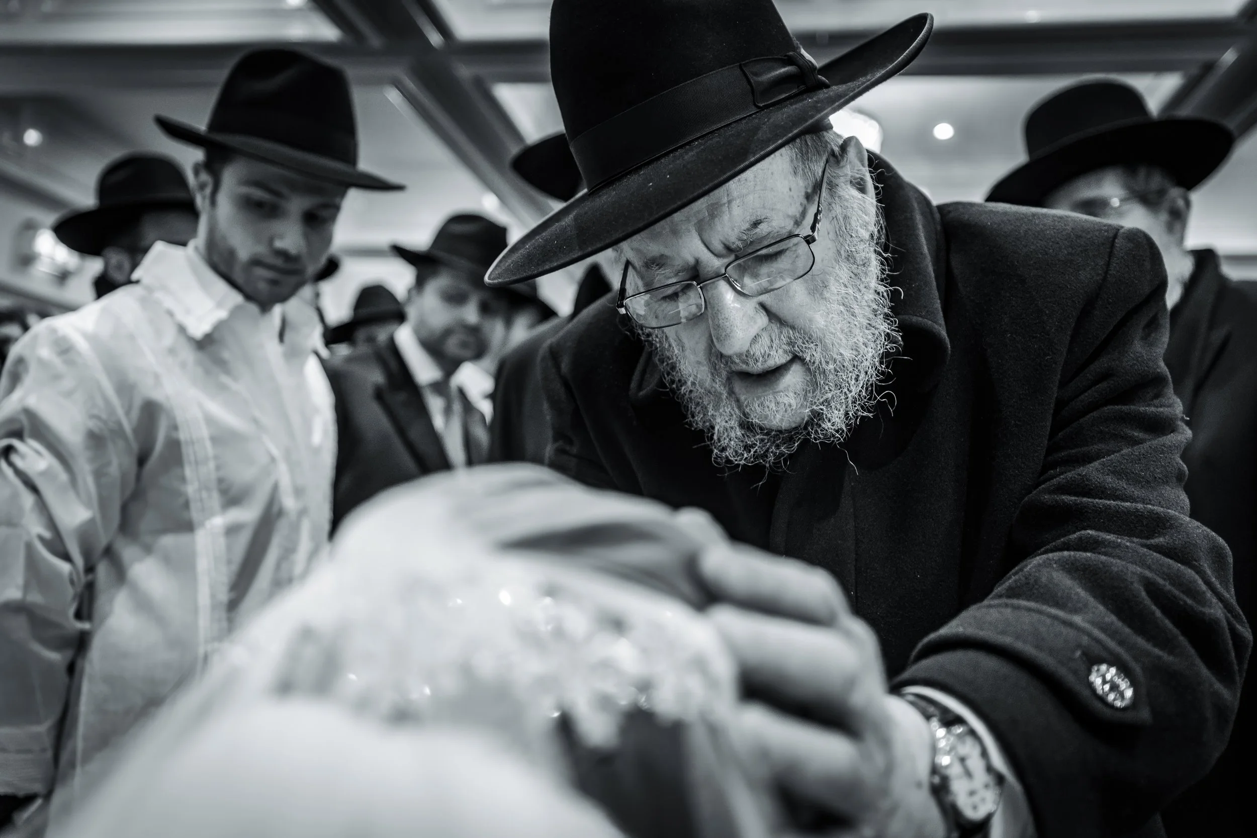 kallah bride receives blessing during bedeken at charedi jewish wedding