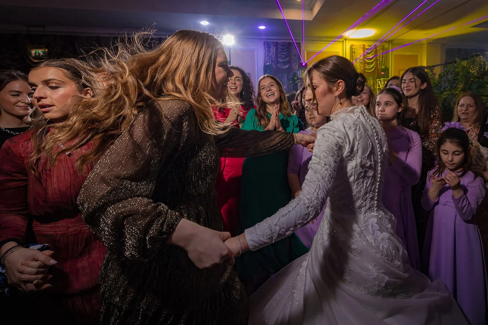 bride dancing during wedding party reception at last drop village in bolton