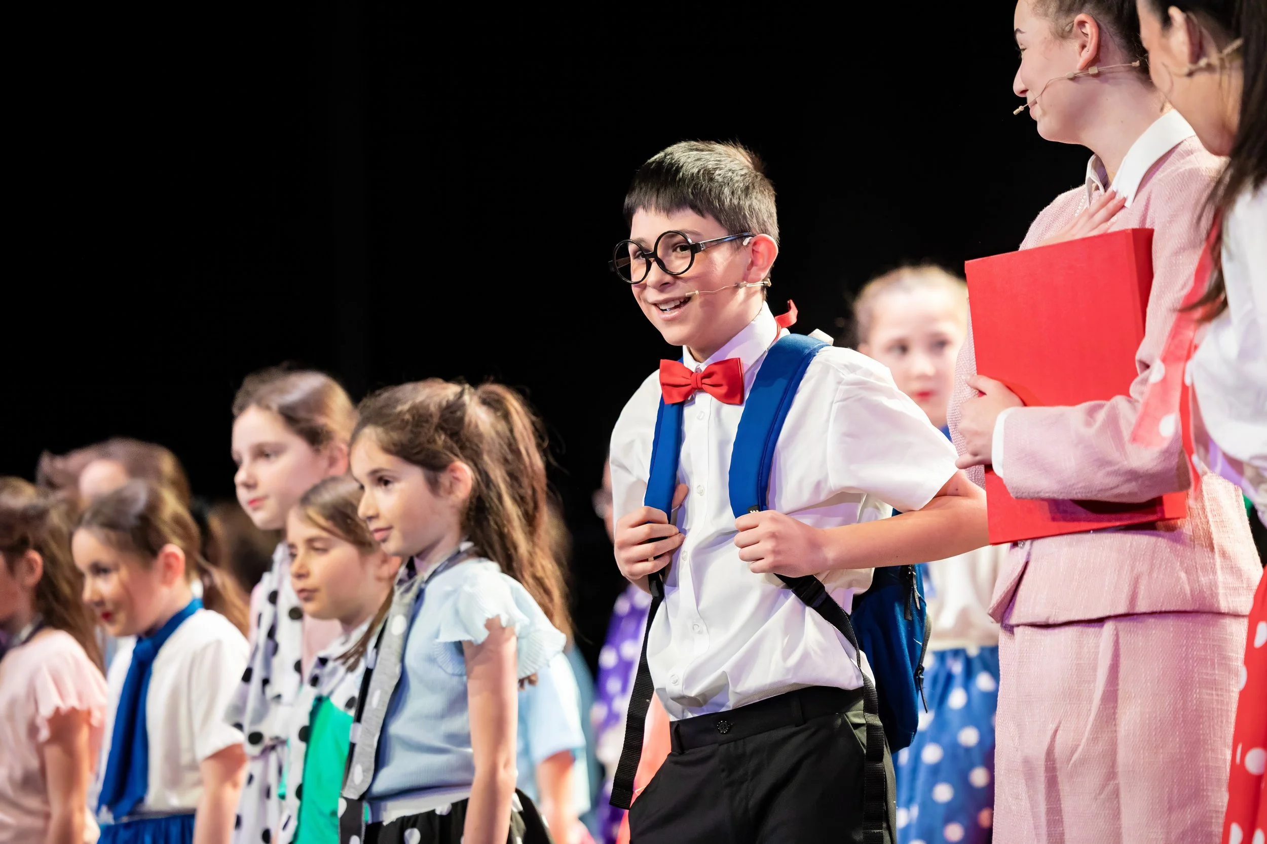Young performers on stage during King David High School's production of Grease
