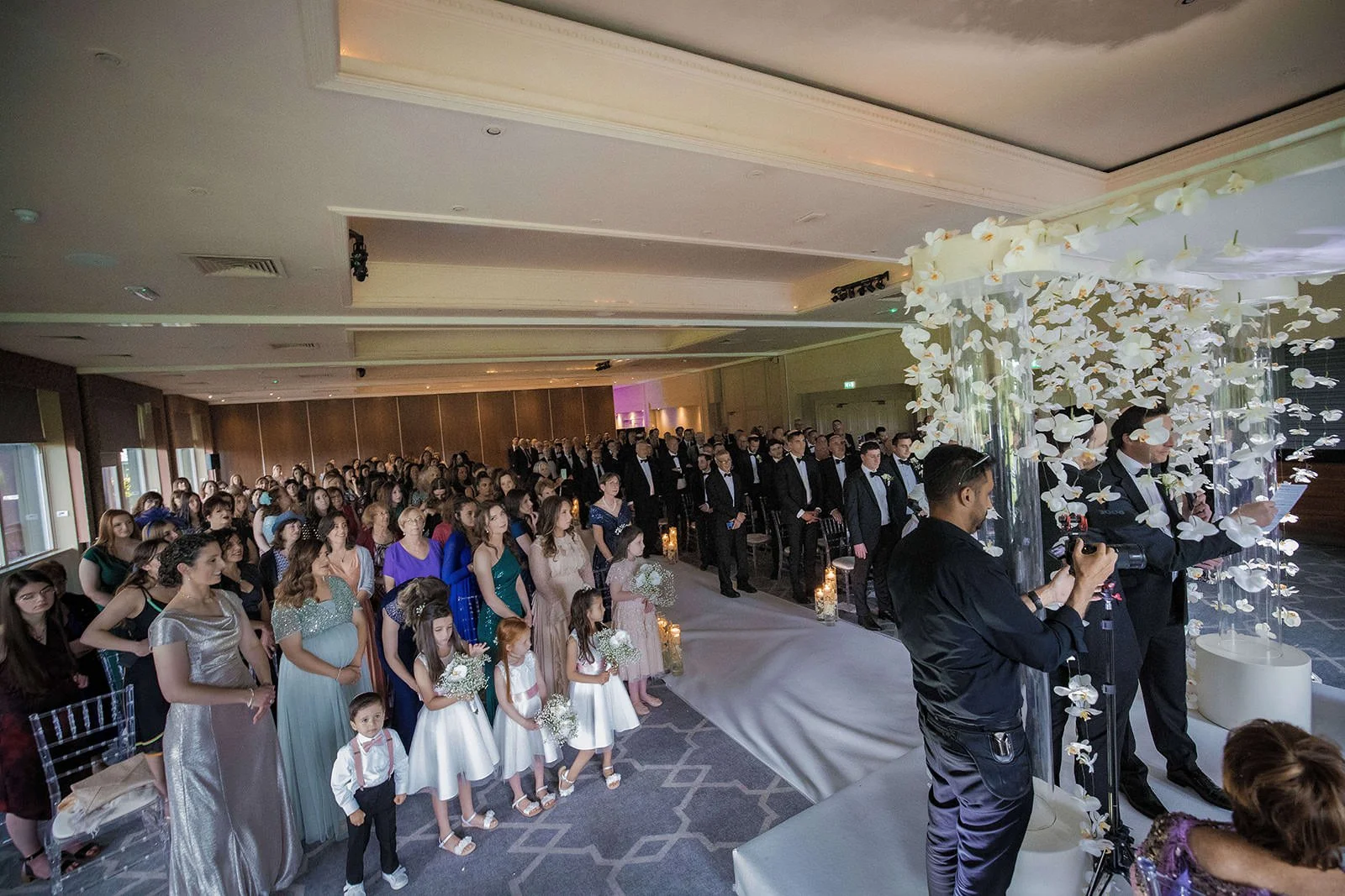wide angle of wedding ceremony at mere golf resort in cheshire