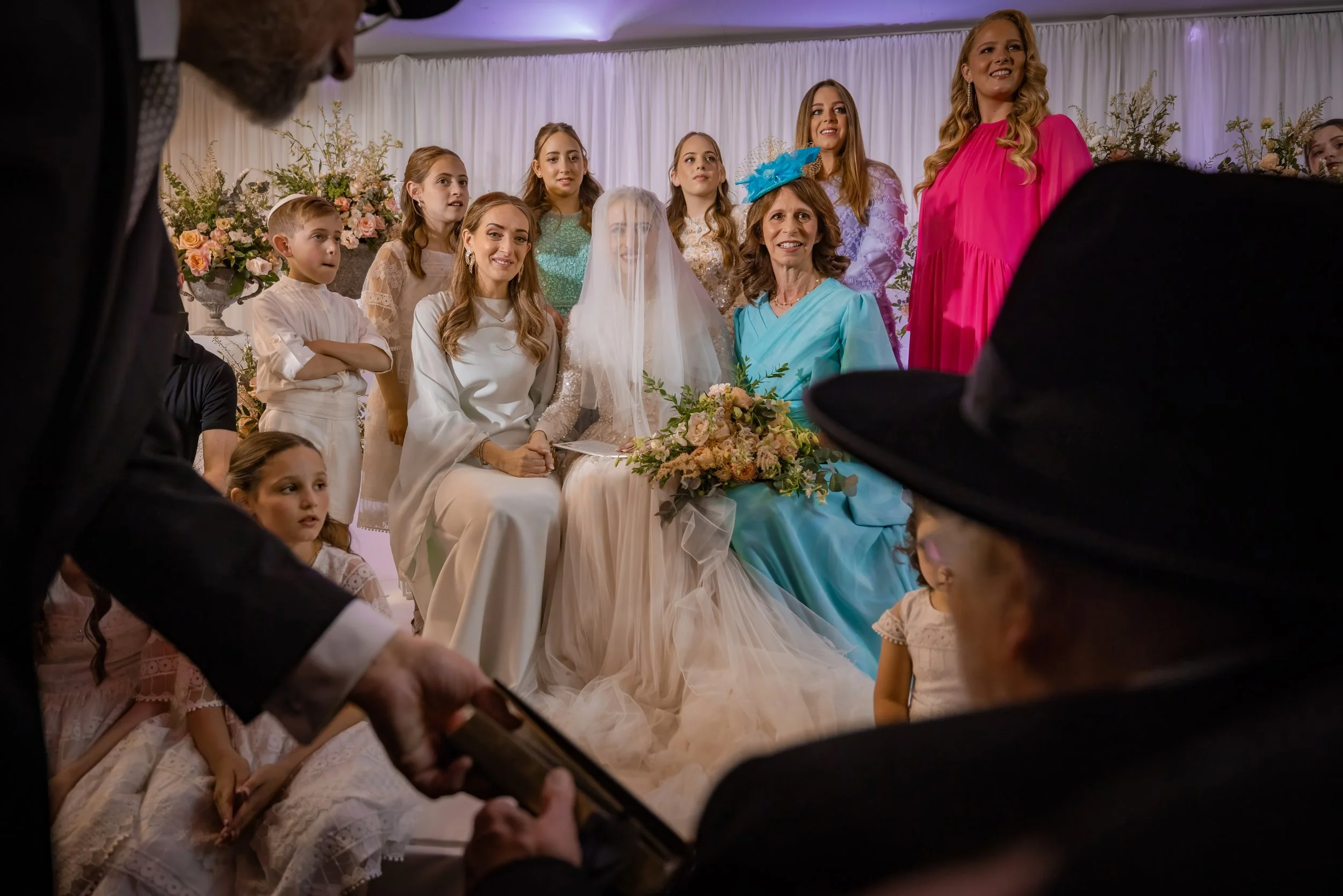 manchester wedding photography jewish bride at bedeken smiling and captured by a manchester wedding photographer
