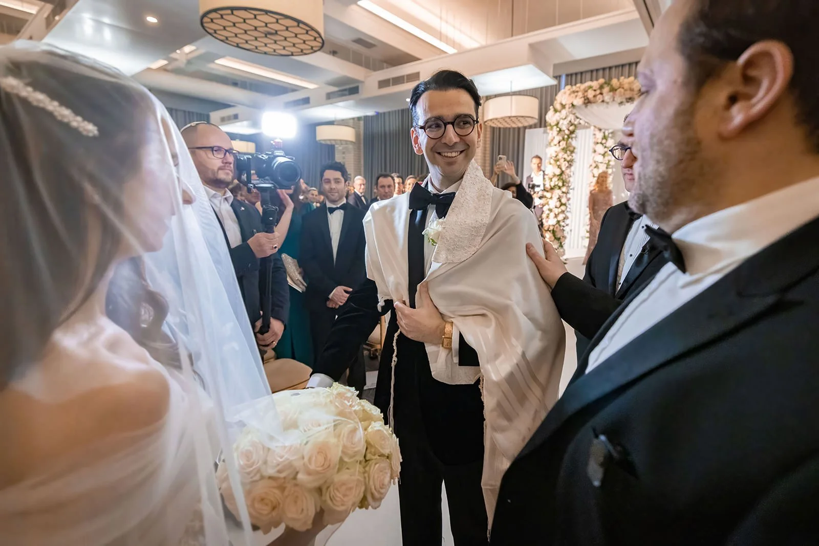 bride and groom exchange vows during wedding ceremony in ballroom at kimpton clocktower manchester