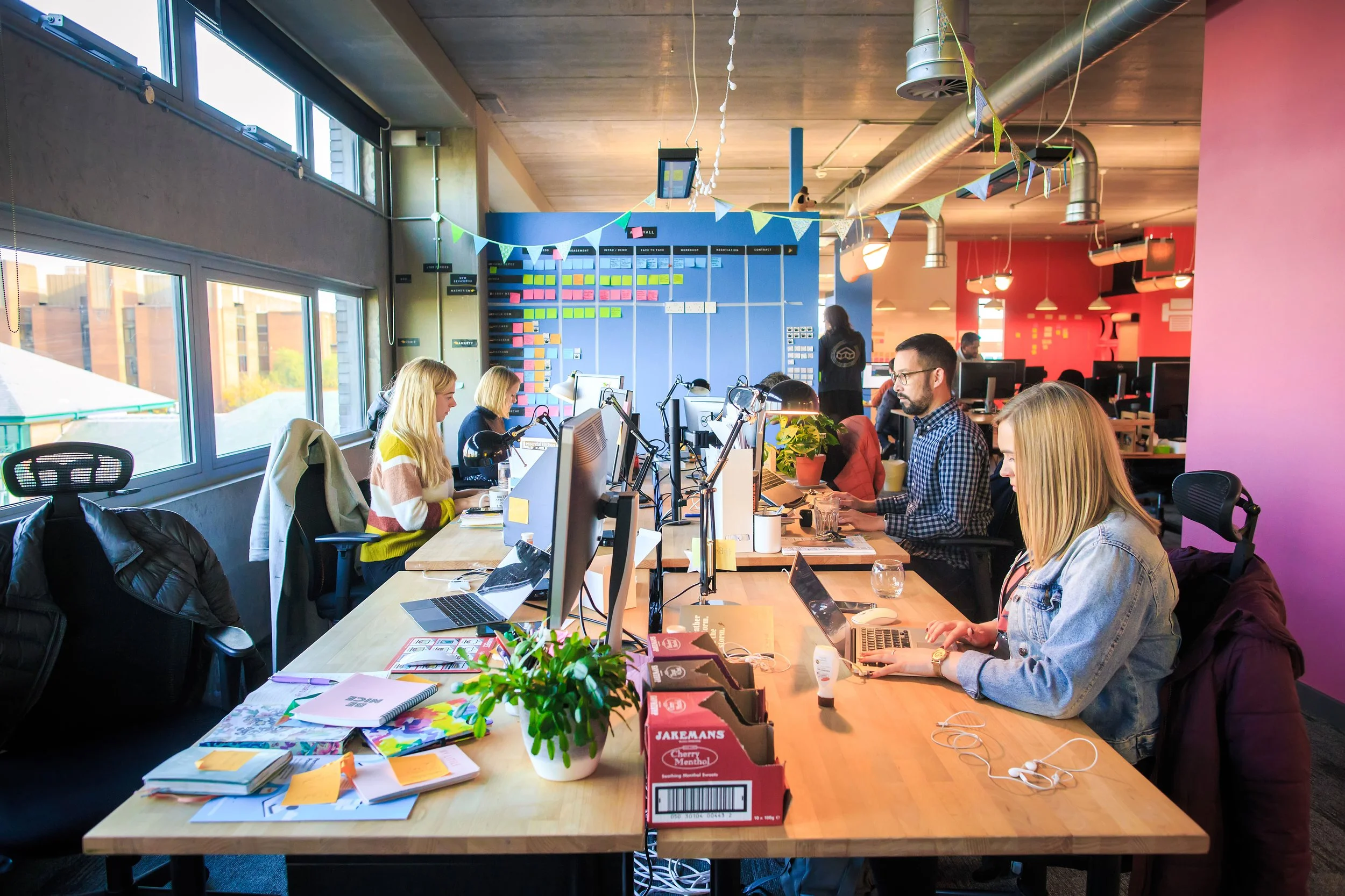 Employees collaborating in an open-plan office environment