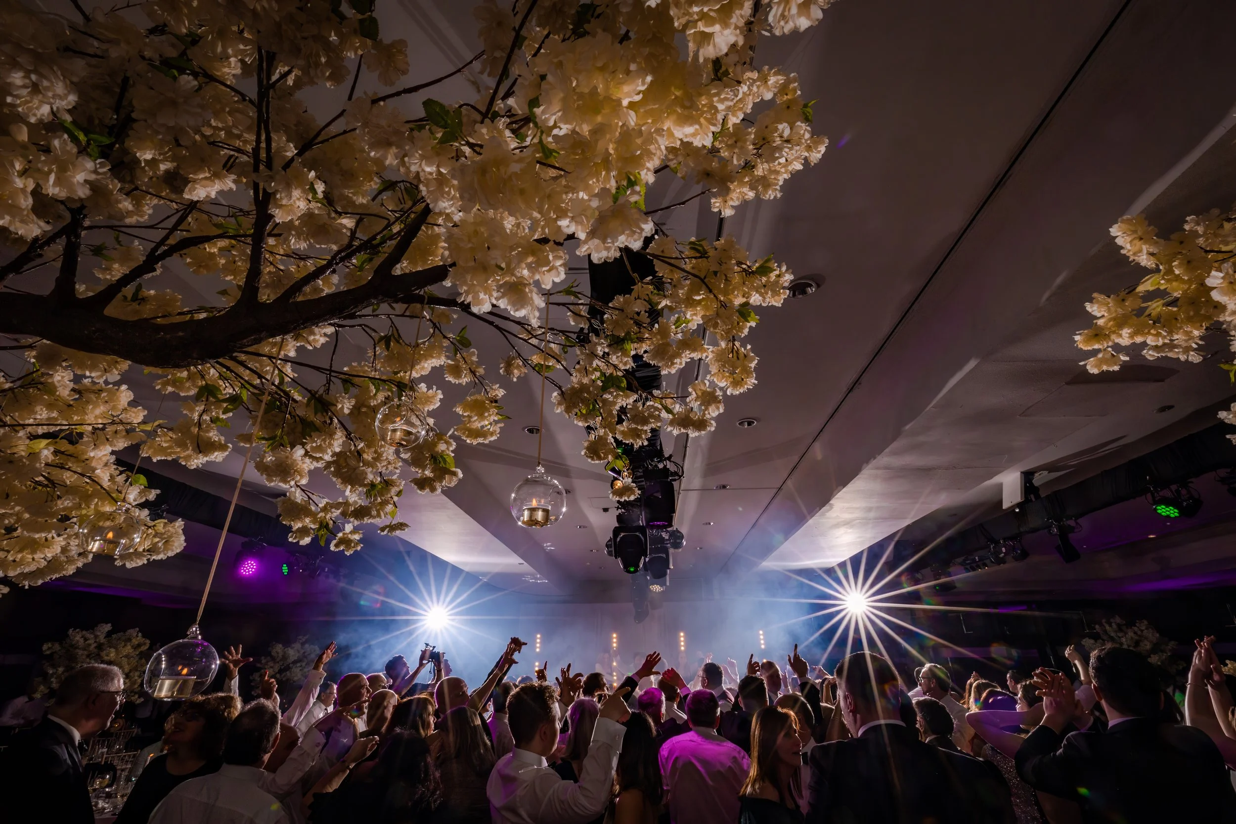 atmospheric wide angle crowd shot of wedding reception dance floor at midland hotel
