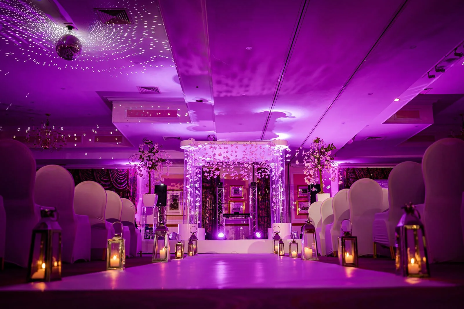 last drop village bolton wedding ceremony indoor set up with candles and flowers