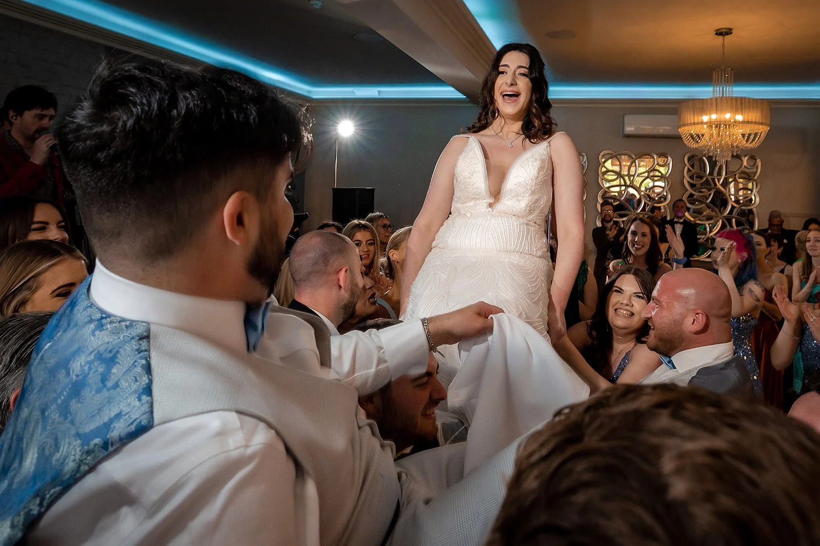 Merrydale Manor wedding guests lifting bride on chair dancing – fine art wedding photographer North West
