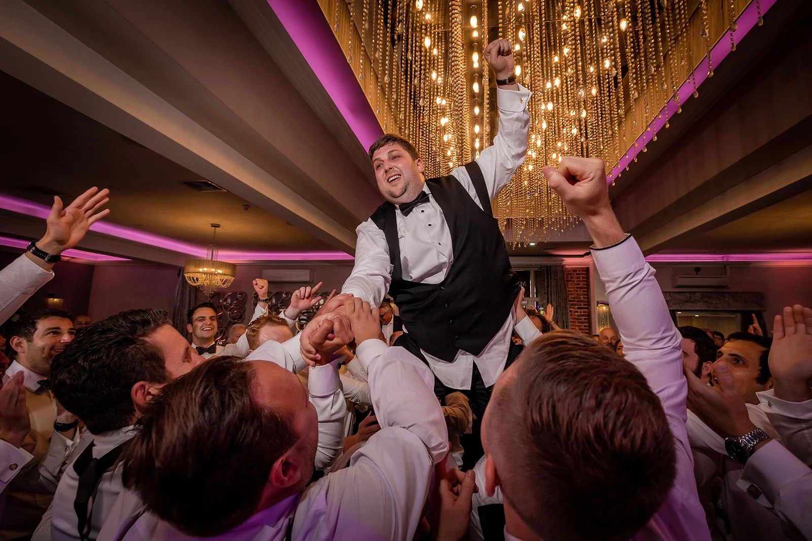 Merrydale Manor wedding groomsmen celebrating at reception – Manchester wedding photographer