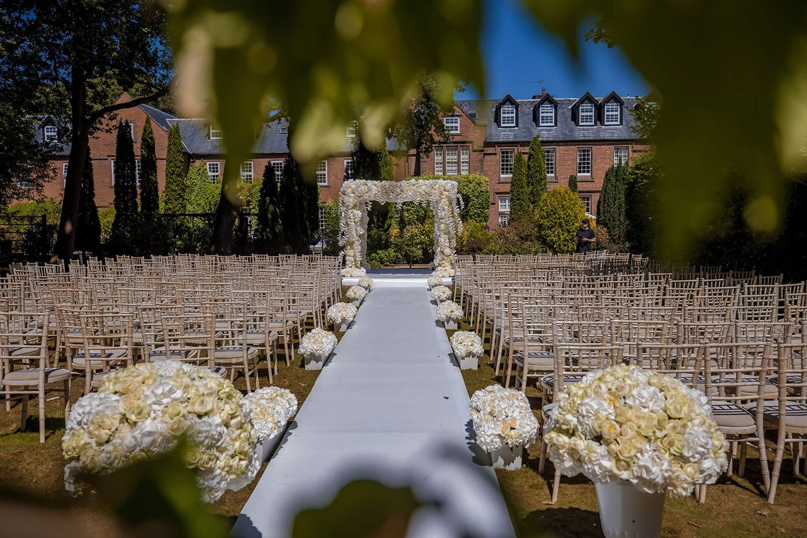 outdoor wedding ceremony set up in Italian gardens at nunsmere hall venue in cheshire