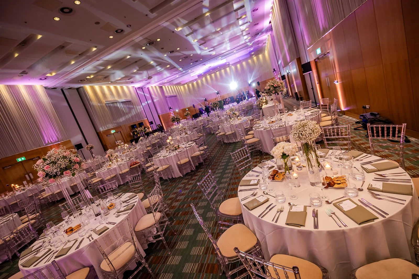 manchester deansgate hotel wedding reception room set up for dinner and dancing with decor and lighting