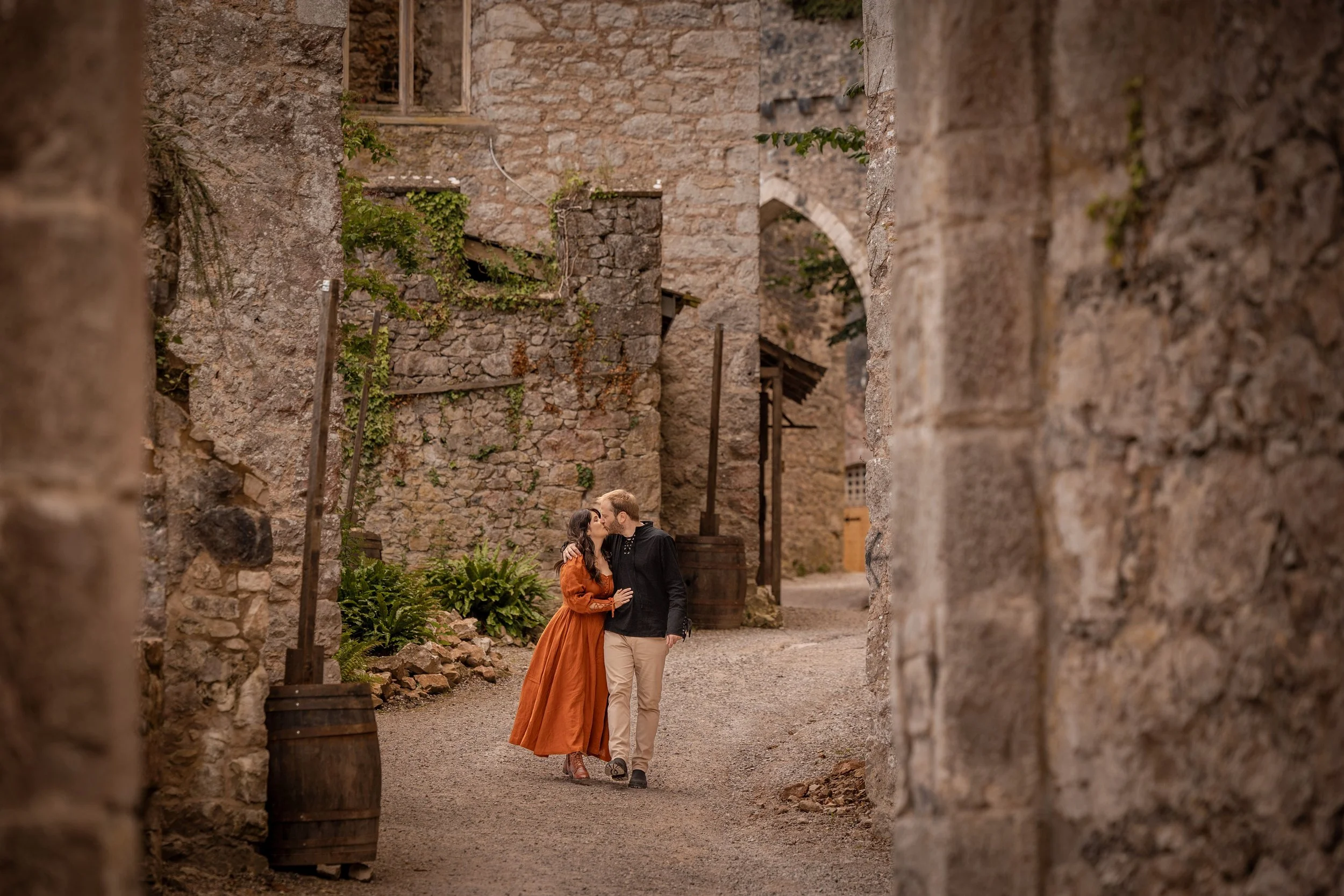 engagement portrait session with happy couple in castle in Wales