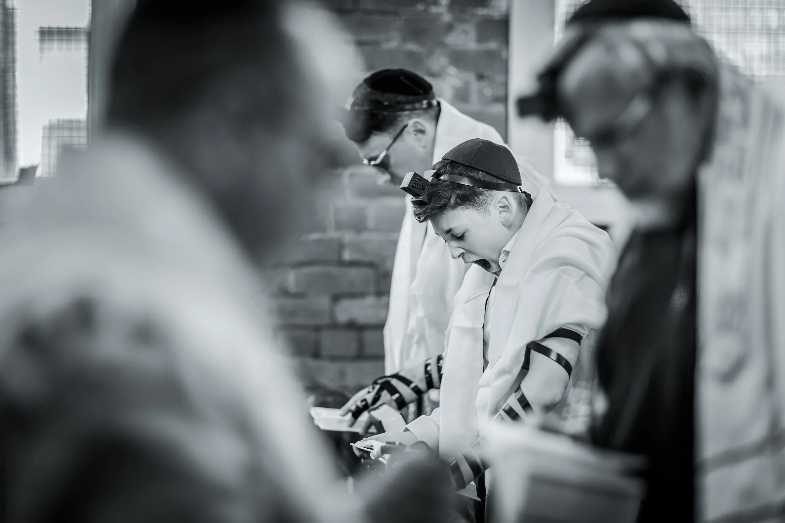 barmitzvah boy yawns during morning call up service in synagogue in Manchester
