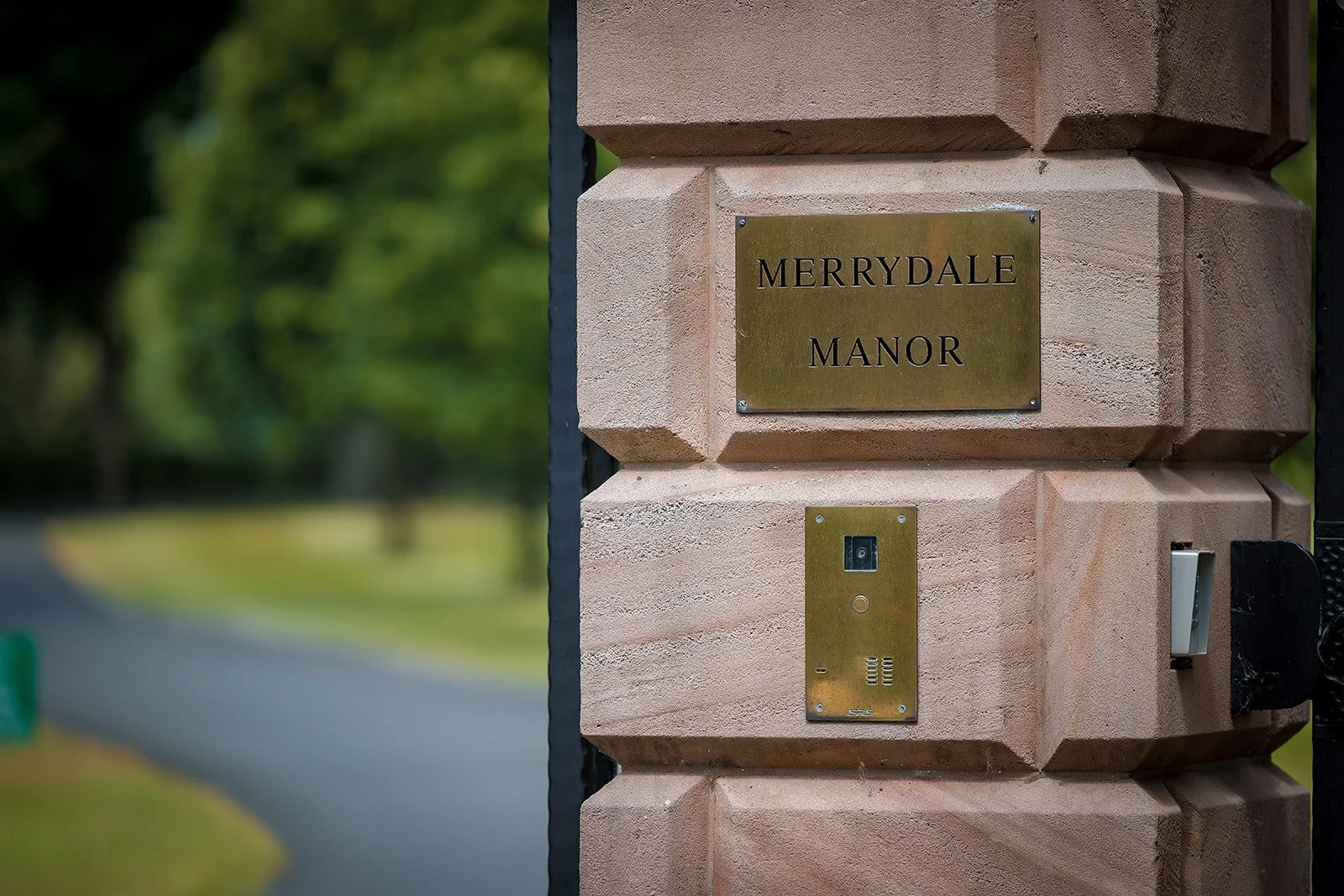 Merrydale Manor wedding venue entrance gate with brass plaque – fine art wedding photographer North West