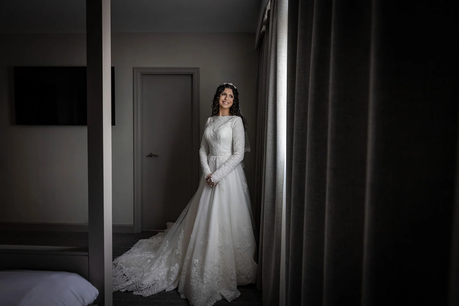 bride portrait by window during prep at mercure manchester piccadilly