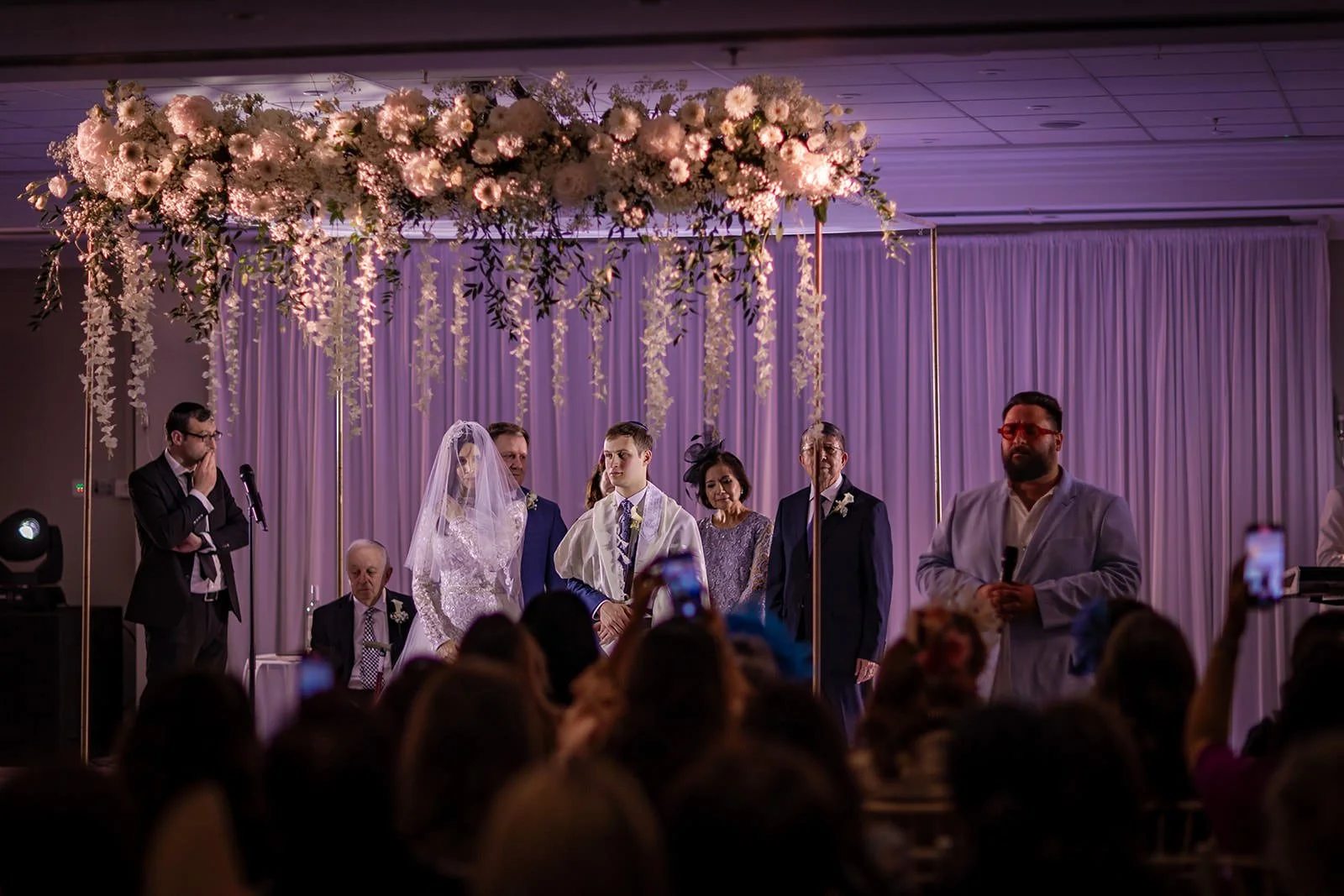 bride and groom exchange vows duuring indoor wedding ceremony at worsley marriott hotel