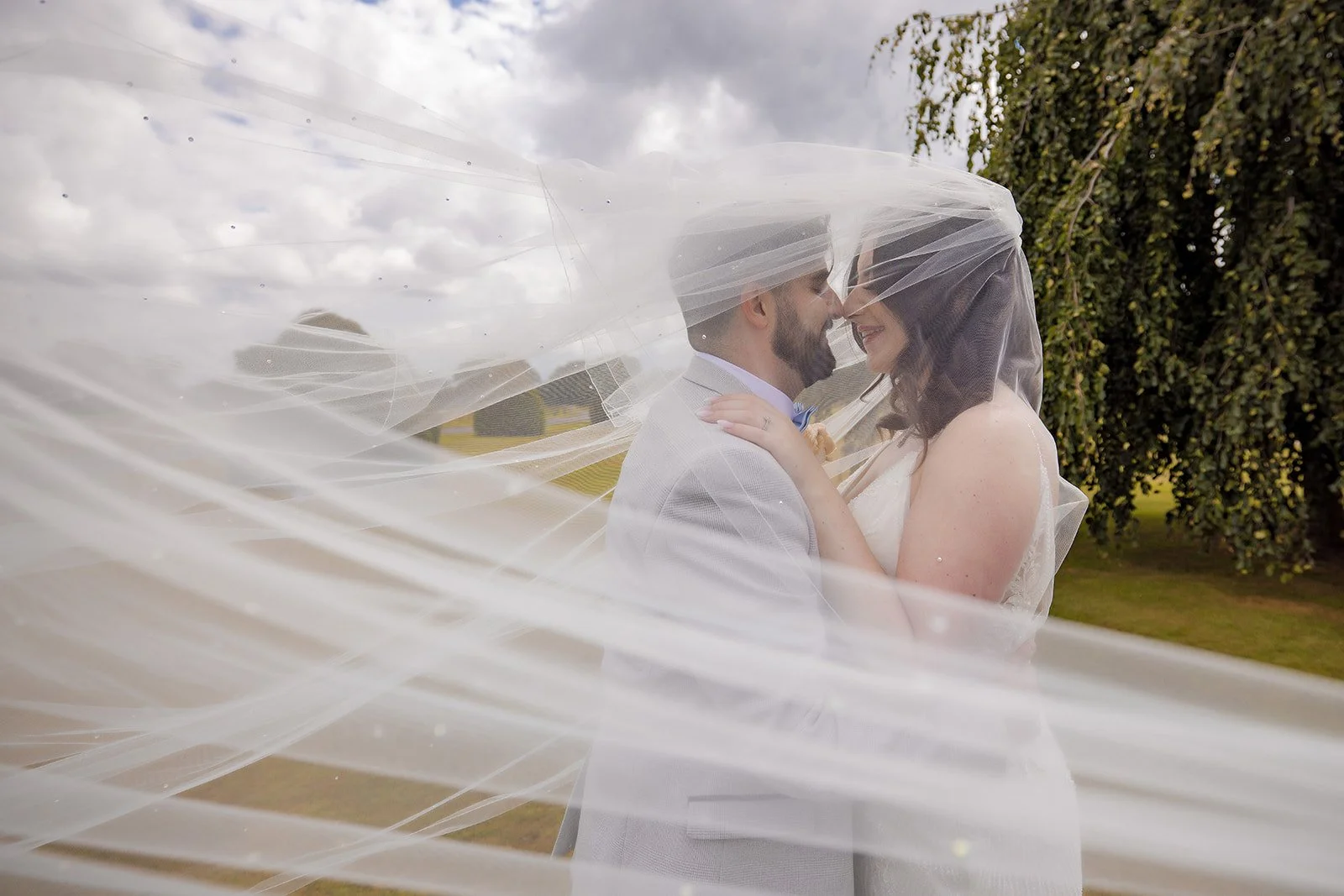 bride and groom romantic portrait under veil at merrydale manor in cheshire