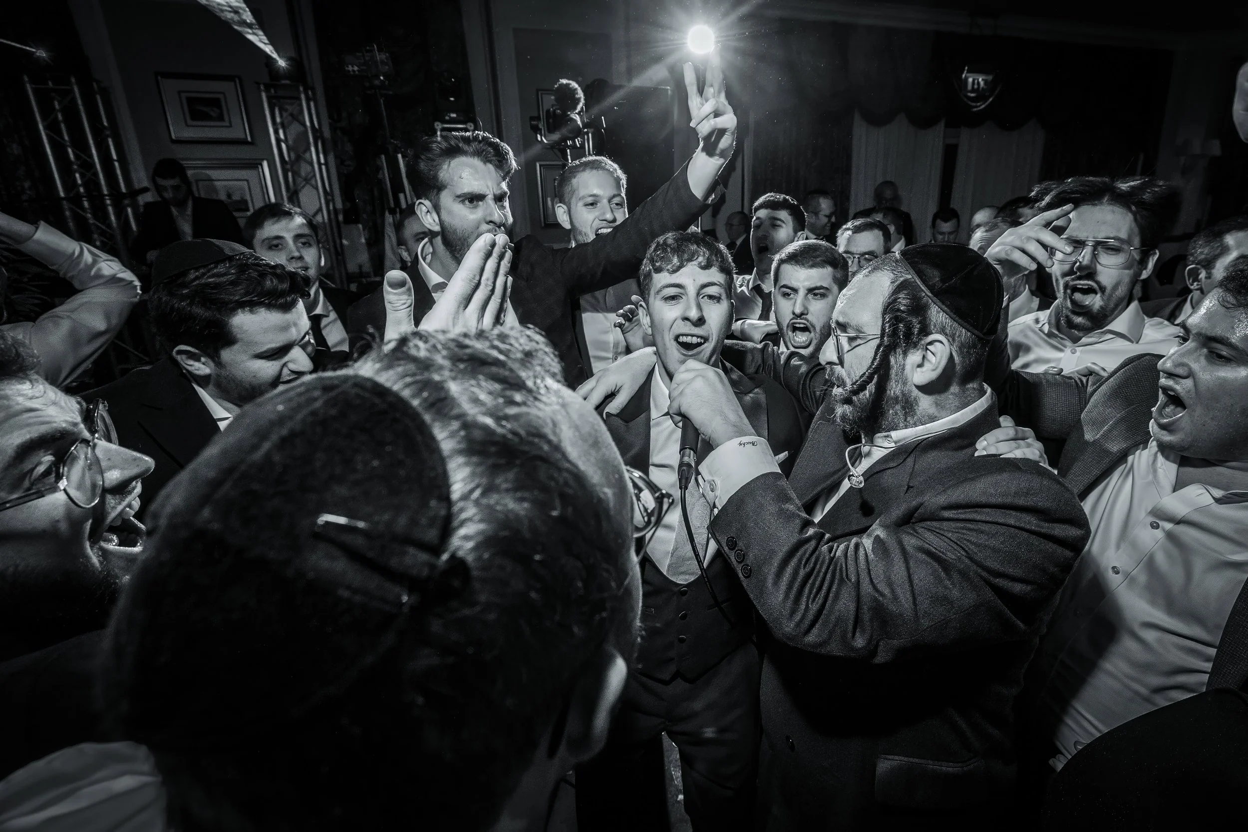 chosson groom sings on dancefloor at charedi jewish wedding