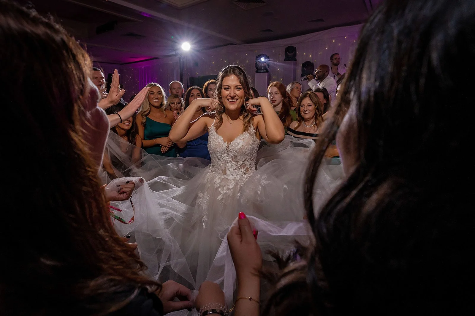 Bride celebrating on dance floor at evening reception, The Mere Knutsford
