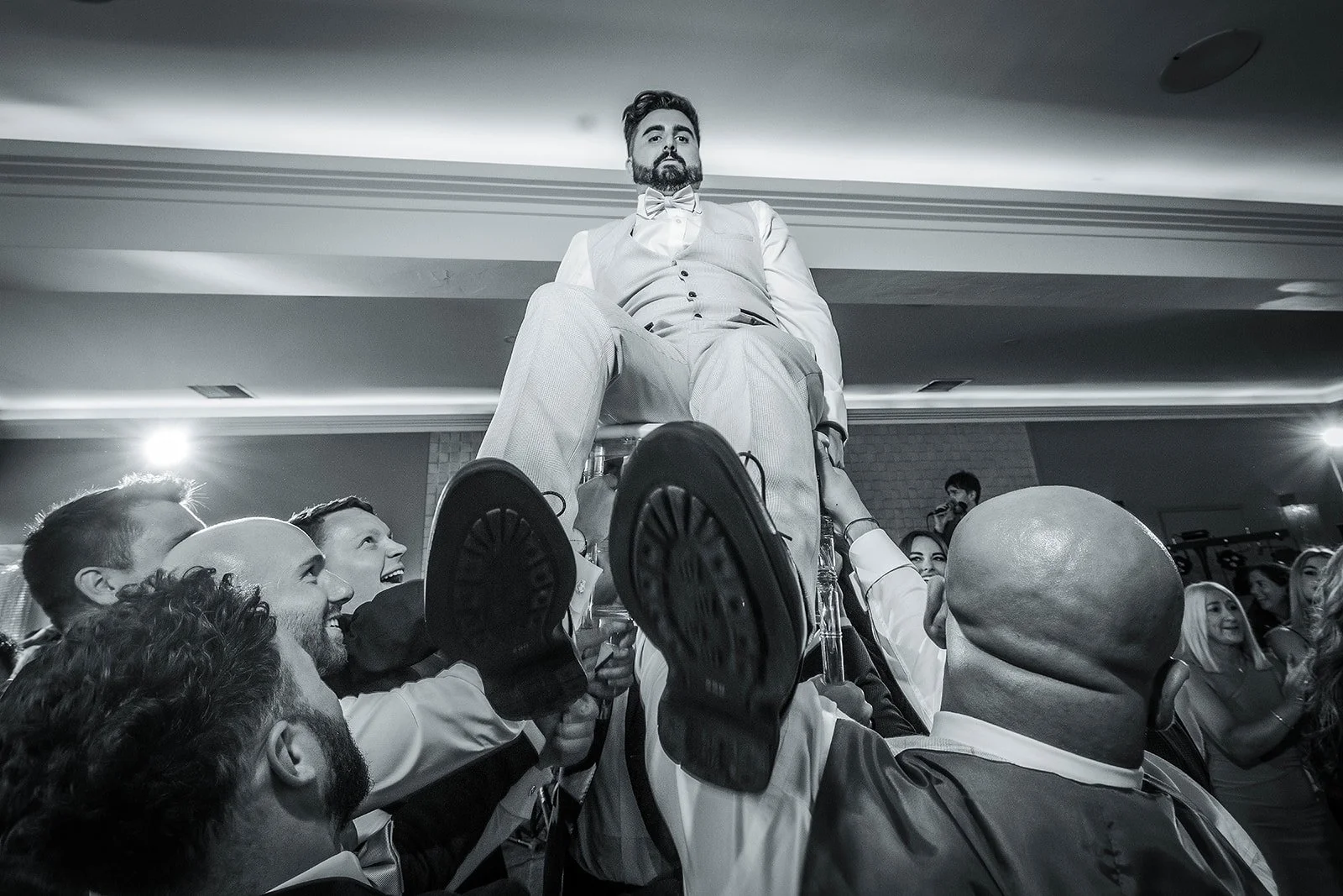Merrydale Manor wedding groom lifted on chair at reception – wedding photography Cheshire